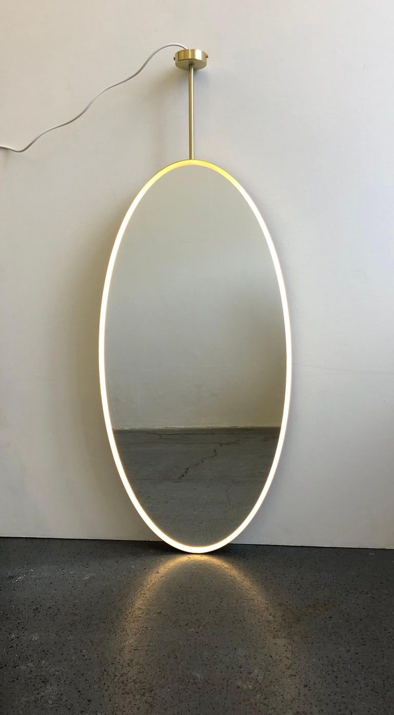 Powder-Coated Ovalis Suspended Mirror with a Brass Frame and Front Illumination, Customisable For Sale