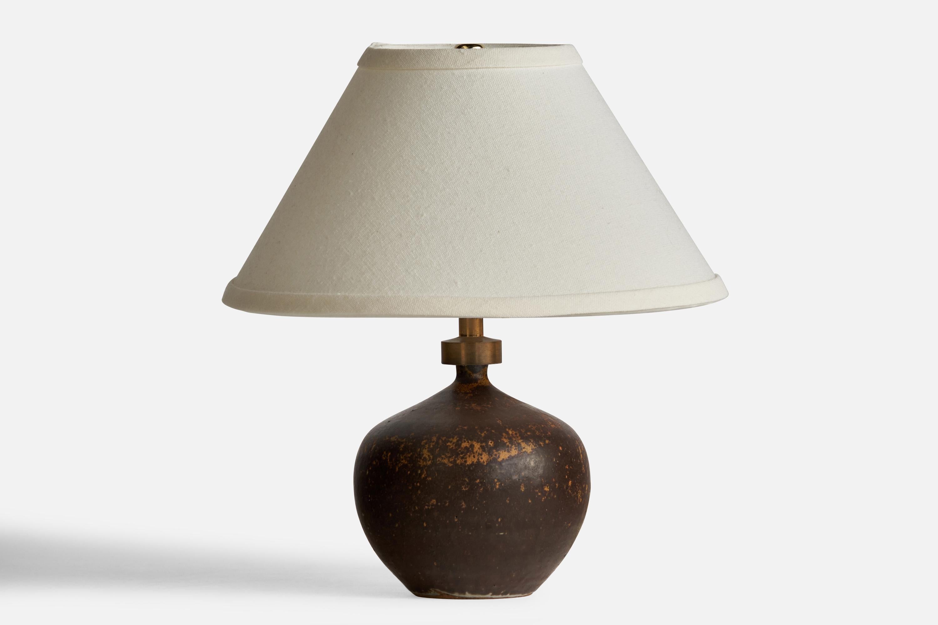 A brown-glazed ceramic and brass table lamp designed and produced by Ove Rasmussen-Vaedelund, Denmark, c. 1960s.

Dimensions of Lamp (inches): 8” H x 4.75” Diameter
Dimensions of Shade (inches): 4” Top Diameter x 10” Bottom Diameter x 5.5”