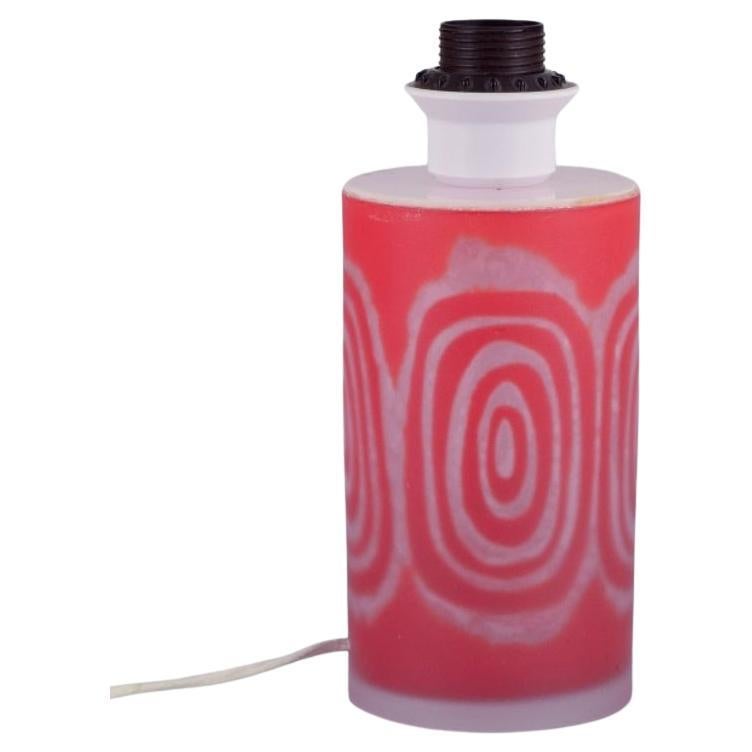 Ove Sandeberg for Kosta Boda, Sweden. Table lamp in orange-colored art glass.