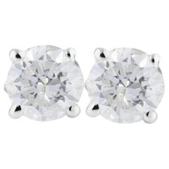 Clous d'oreilles solitaires en or blanc 14 carats avec diamants naturels de plus de 1/2 carat 