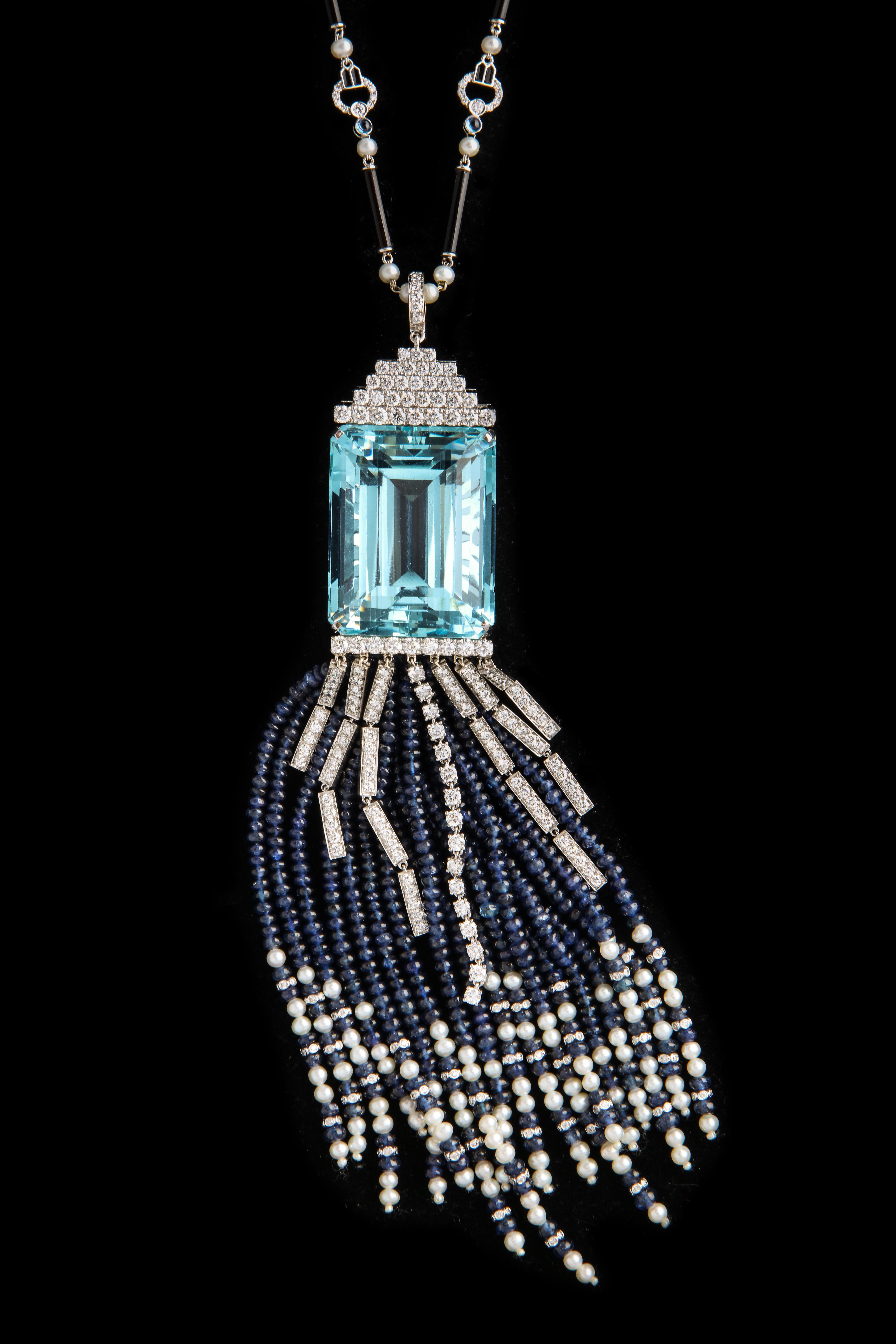 Large Aquamarine and Sapphire Necklace

9.41 ct of Diamonds , 130.02 ct of Sapphires, and a single 118 ct Aquamarine!