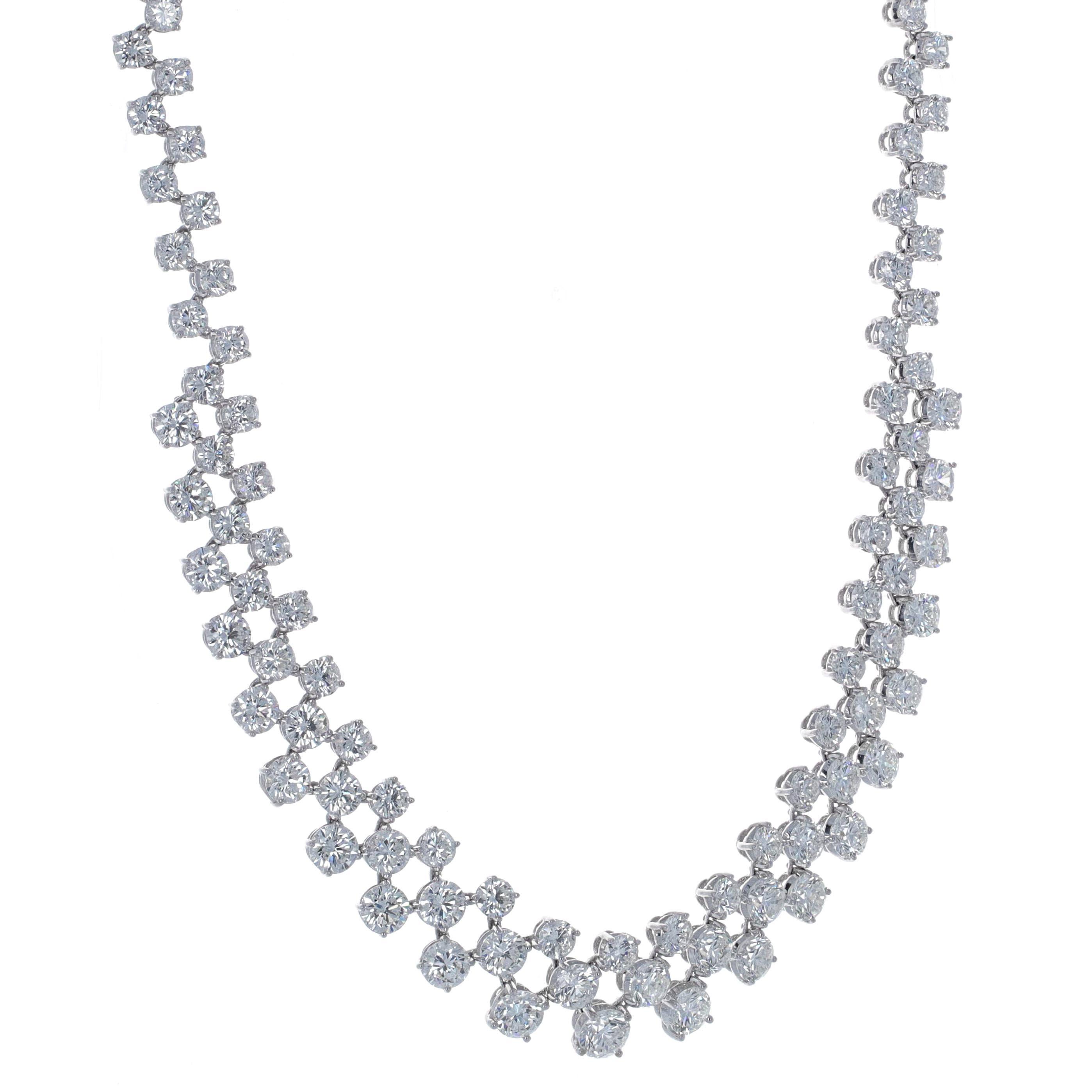 Beautifully made diamond tennis necklace. The necklace lays beautifully and is a show stopper. The design of the necklace is more impresssive than your ordinary diamond riviera. There is more style, sparkle and uniqueness. The necklace is made in 18