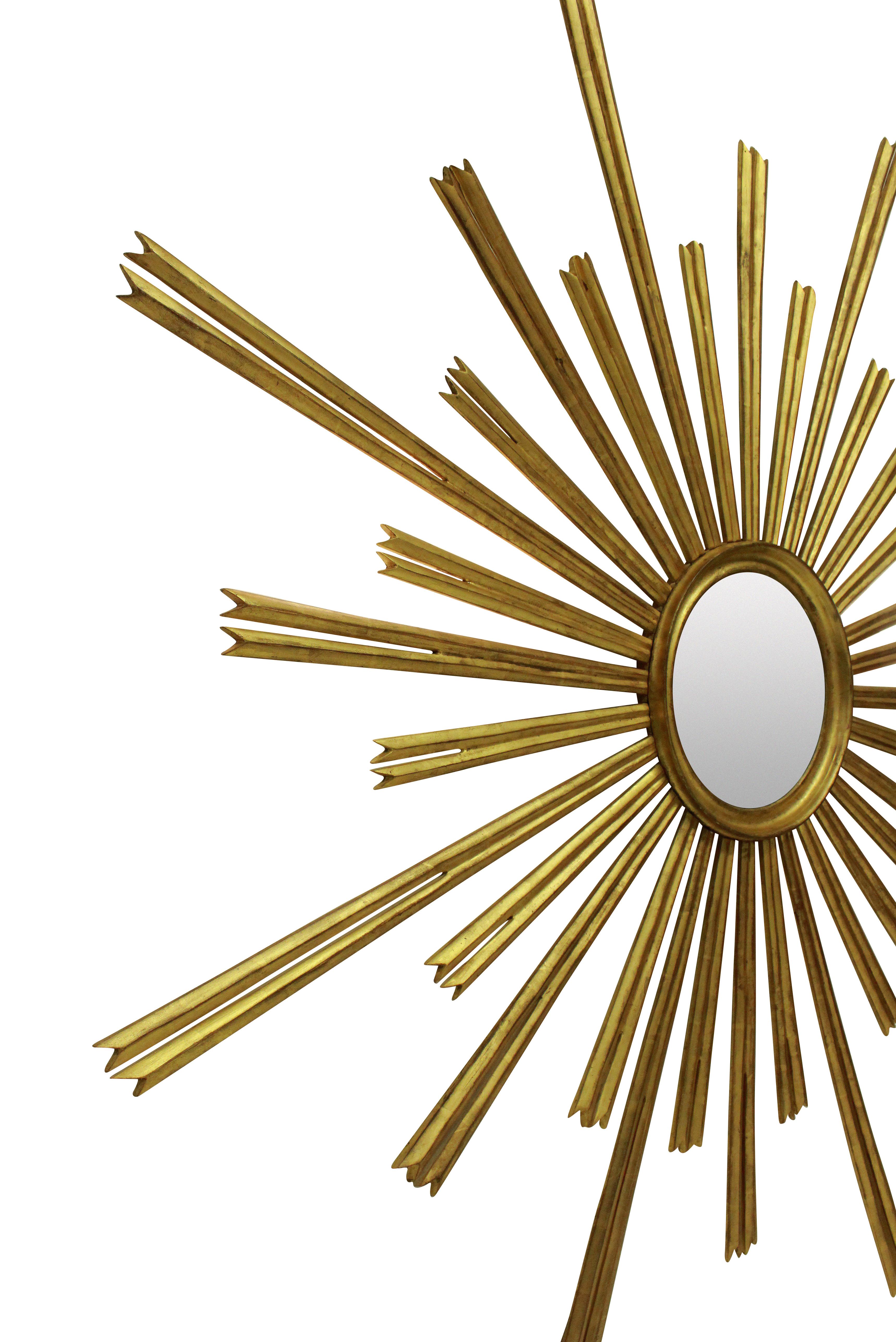 An over-scale French giltwood sunburst mirror, after a Louis XIV design. With slight foxing to the mercury glass plate.