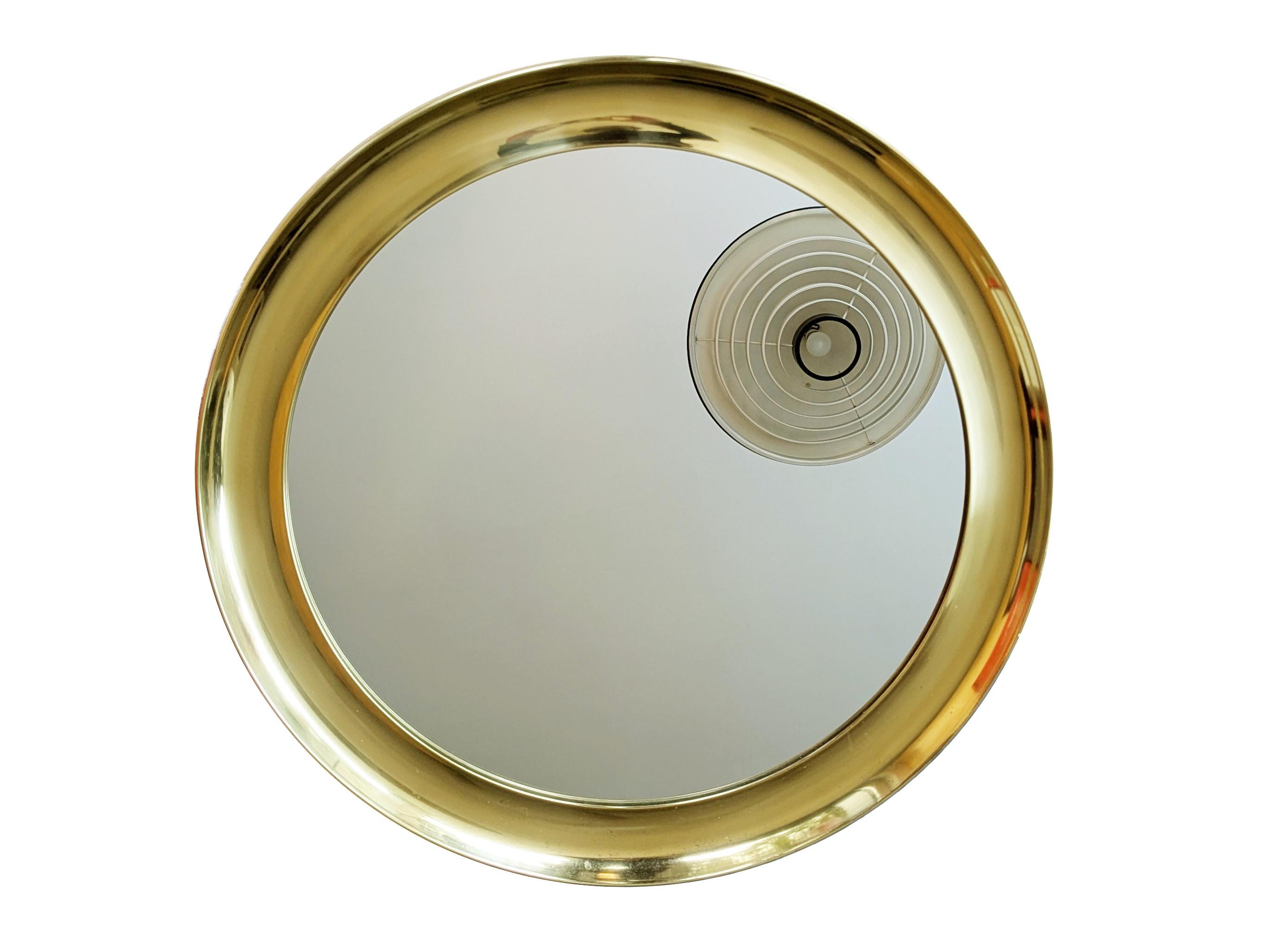 Large mirror with brass frame and ornament in cast brass/bronze. Visible oxidation patina. Very good vintage condition.