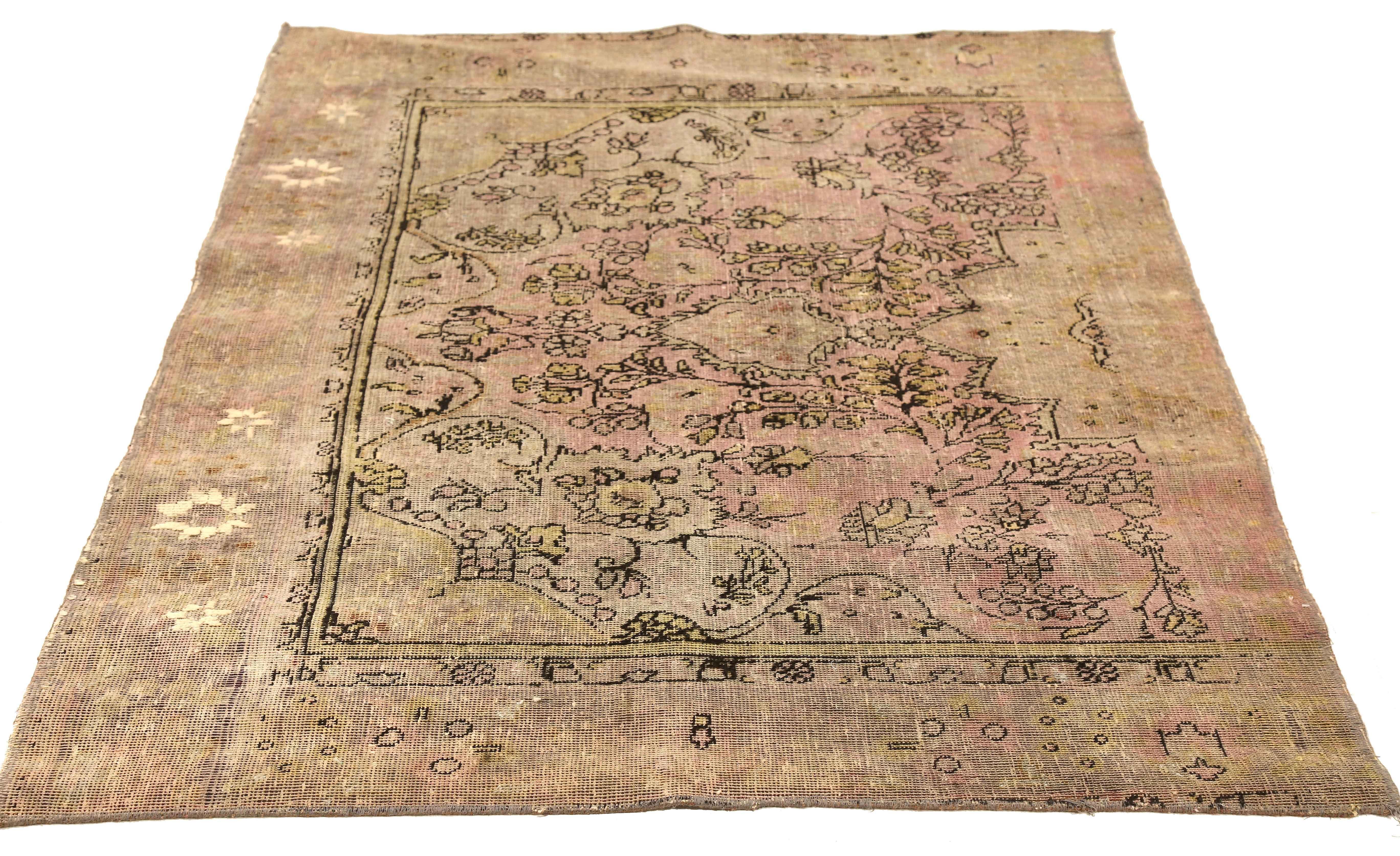 Contemporary handmade Persian area rug from high-quality sheep’s wool and colored with eco-friendly vegetable dyes that are proven safe for humans and pets alike. It’s an overdyed piece with black and pink botanical details. It has a dimension of