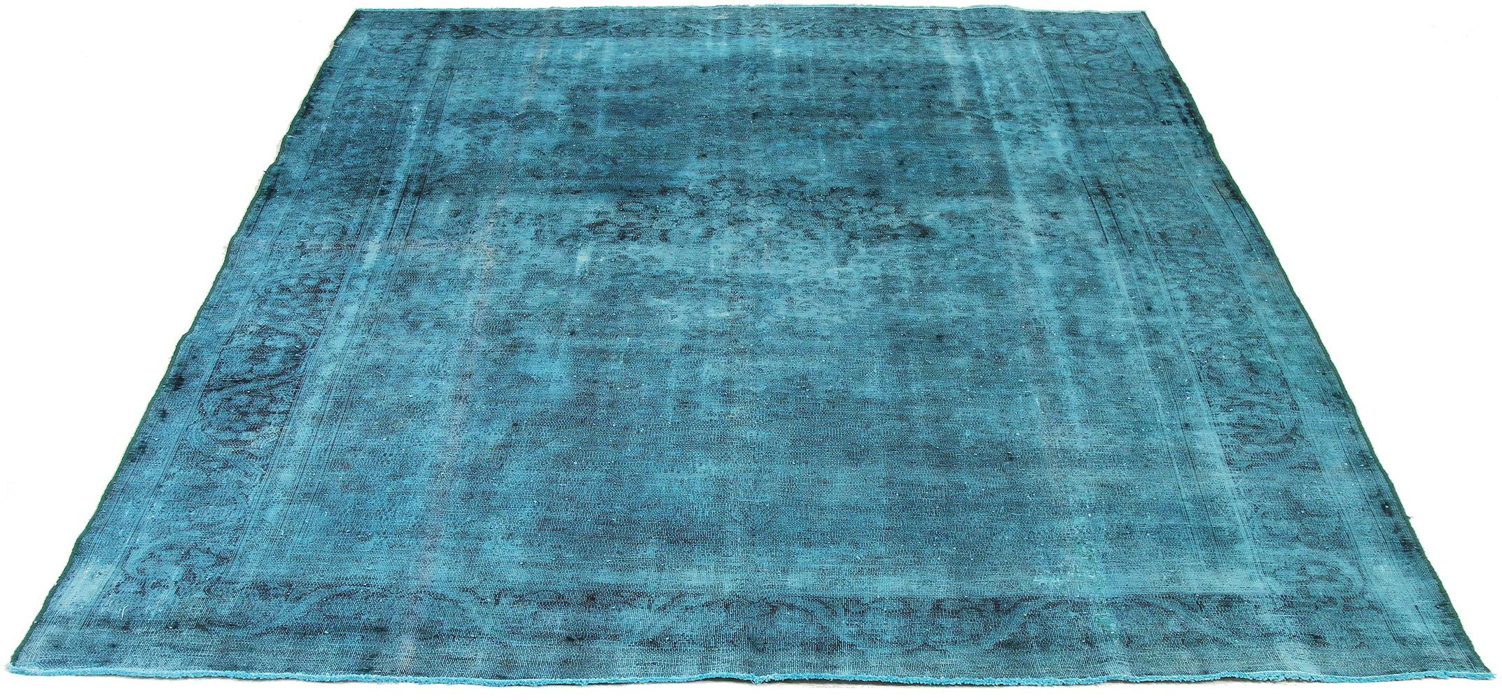 Vintage handmade Persian area rug from high-quality sheep’s wool and colored with eco-friendly vegetable dyes that are proven safe for humans and pets alike. It’s an overdyed piece with faded blue and black botanical details. It has a dimension of