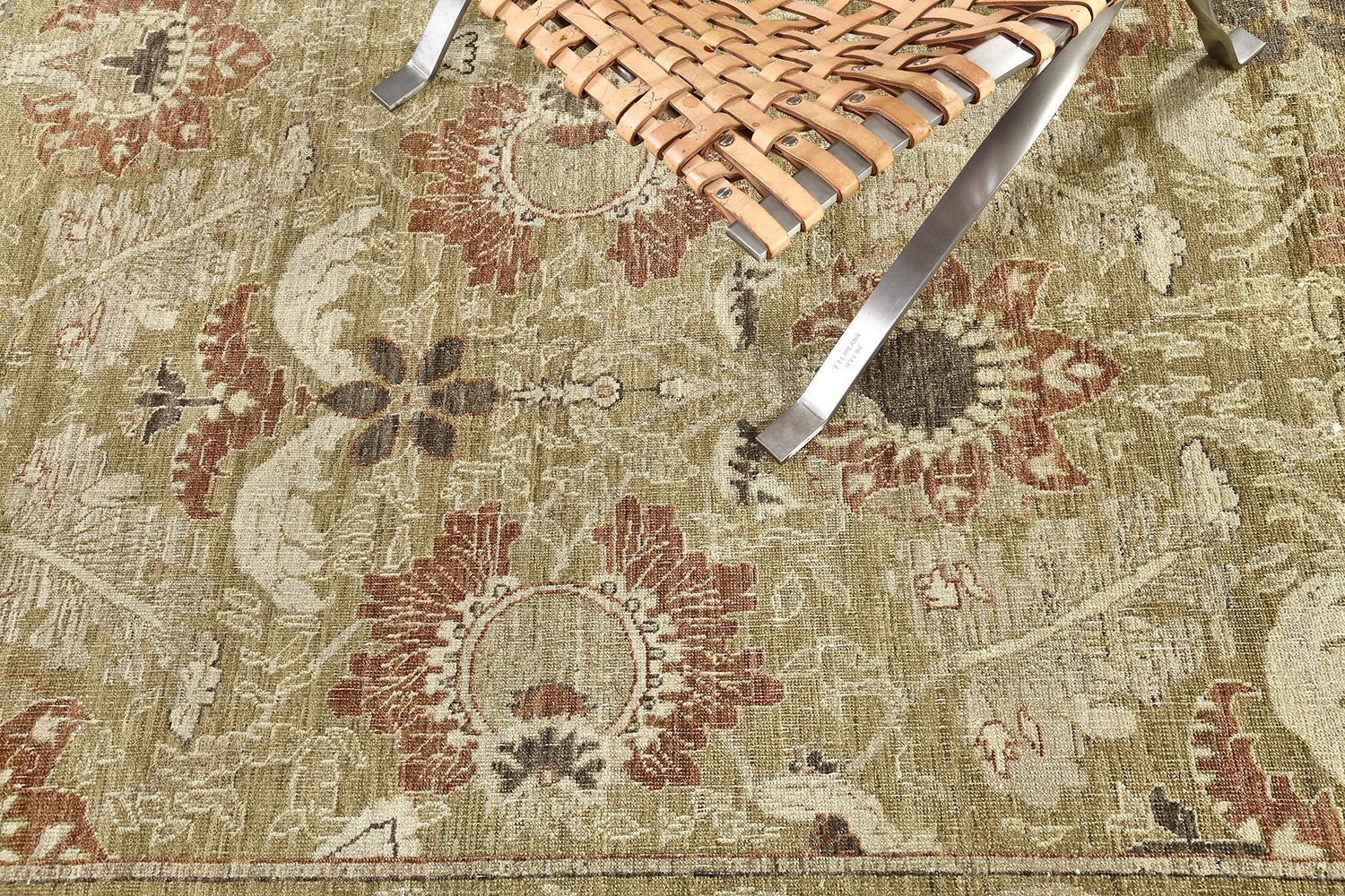 A gloriously impressive Agra rug features an overdyed yellow to gold tone. An elegant pattern is meticulously woven with a dazzling tone. They are known for their unique palette of color, nature schemes are flaunted. This masterwork of art gives a