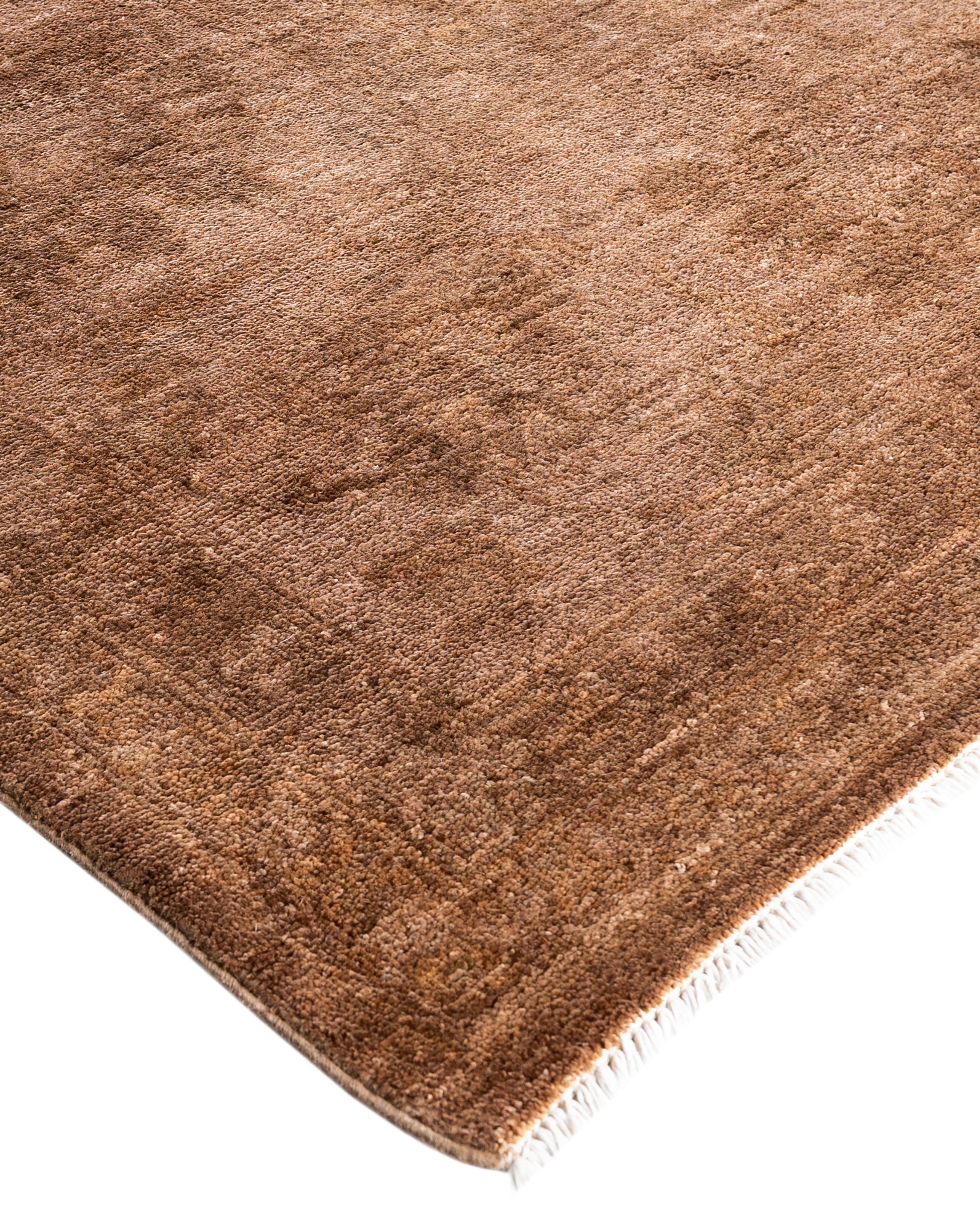 Over-dyed area rugs are created by taking vintage or traditional rugs and applying a vibrant, monochromatic dye over the existing patterns. This technique results in a bold, modern aesthetic while preserving the intricate designs beneath, blending