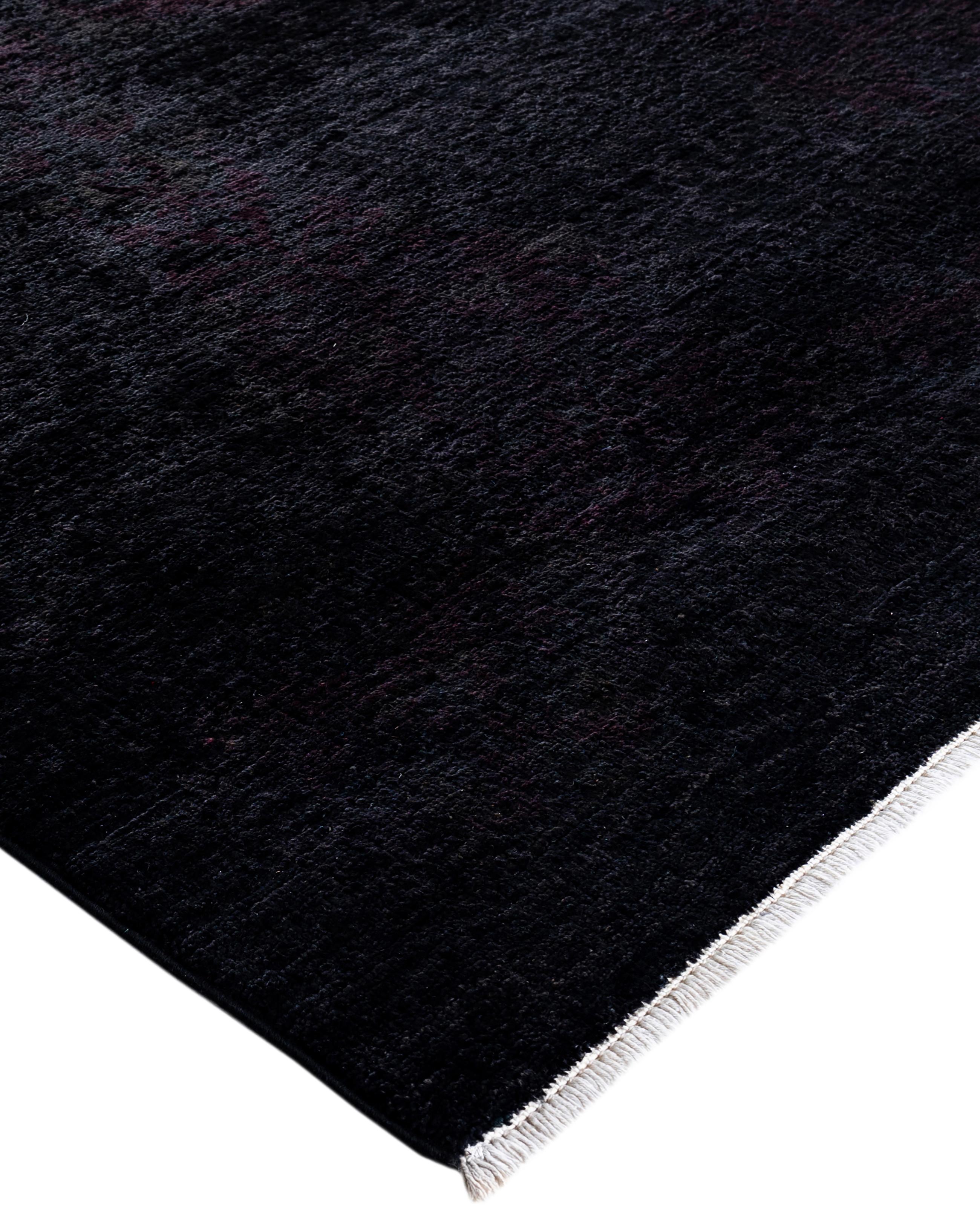 Over-dyed area rugs are created by taking vintage or traditional rugs and applying a vibrant, monochromatic dye over the existing patterns. This technique results in a bold, modern aesthetic while preserving the intricate designs beneath, blending