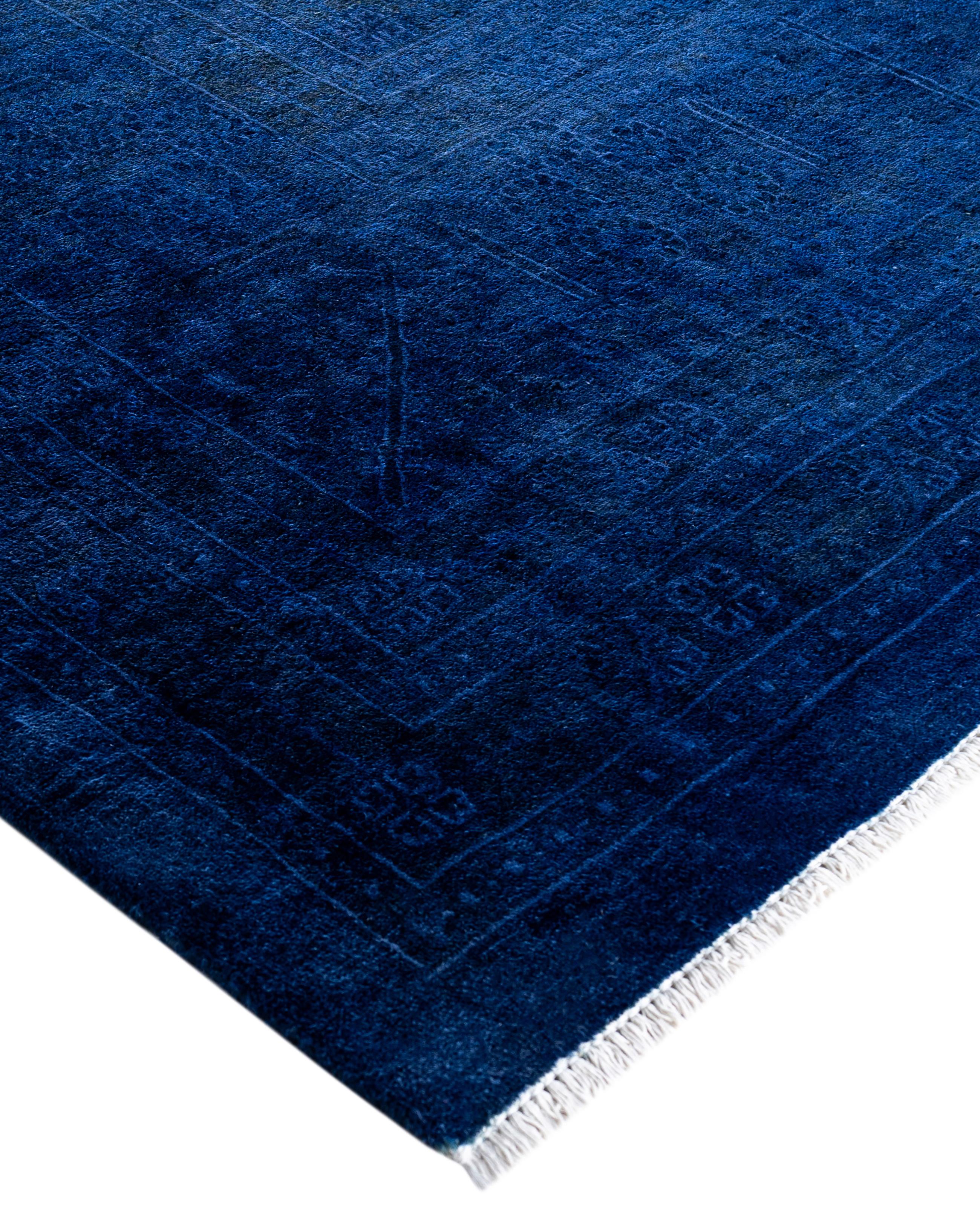 Over-dyed area rugs are created by taking vintage or traditional rugs and applying a vibrant, monochromatic dye over the existing patterns. This technique results in a bold, modern aesthetic while preserving the intricate designs beneath, blending