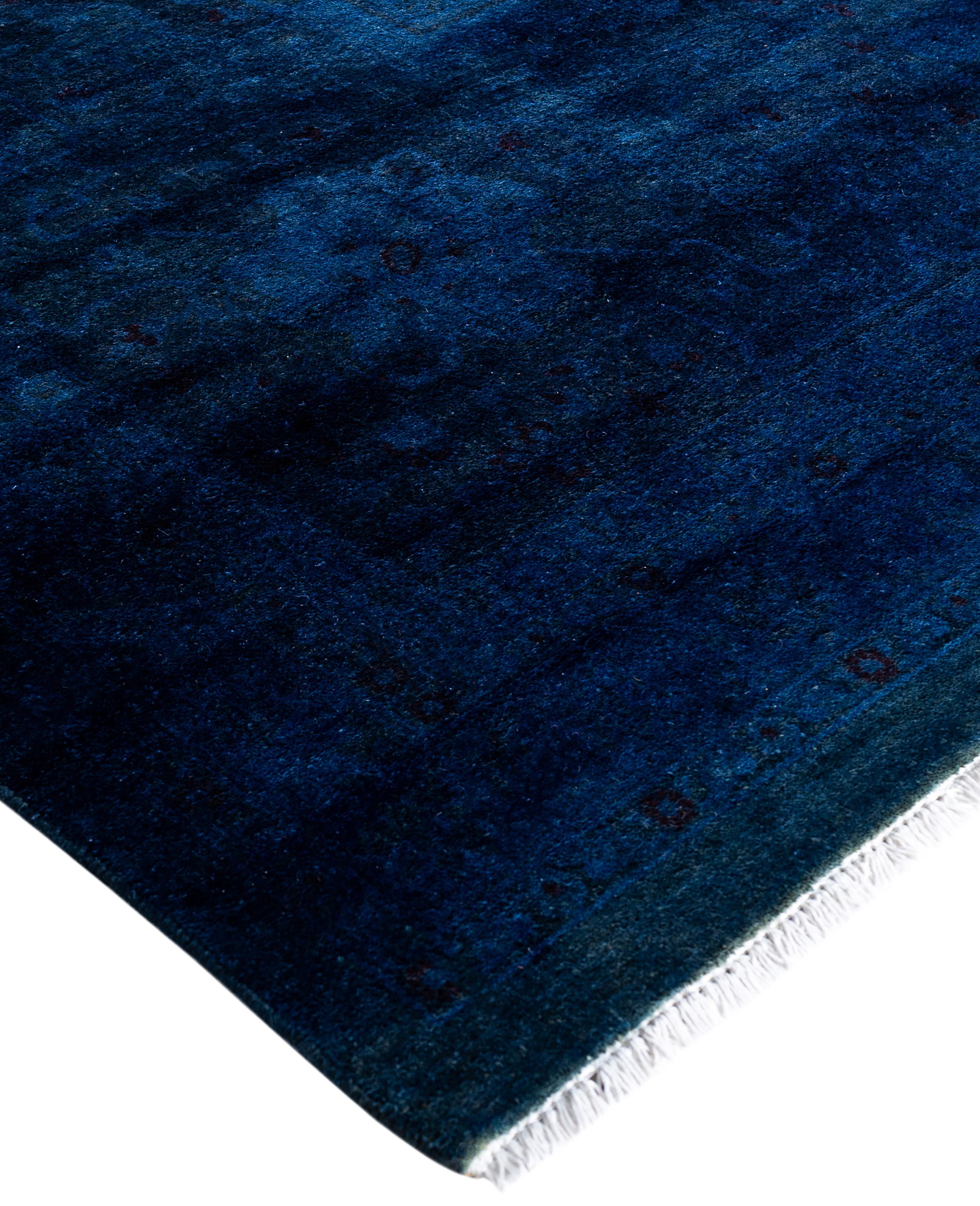 Over-dyed area rugs are created by taking vintage or traditional rugs and applying a vibrant, monochromatic dye over the existing patterns. This technique results in a bold, modern aesthetic while preserving the intricate designs beneath, blending