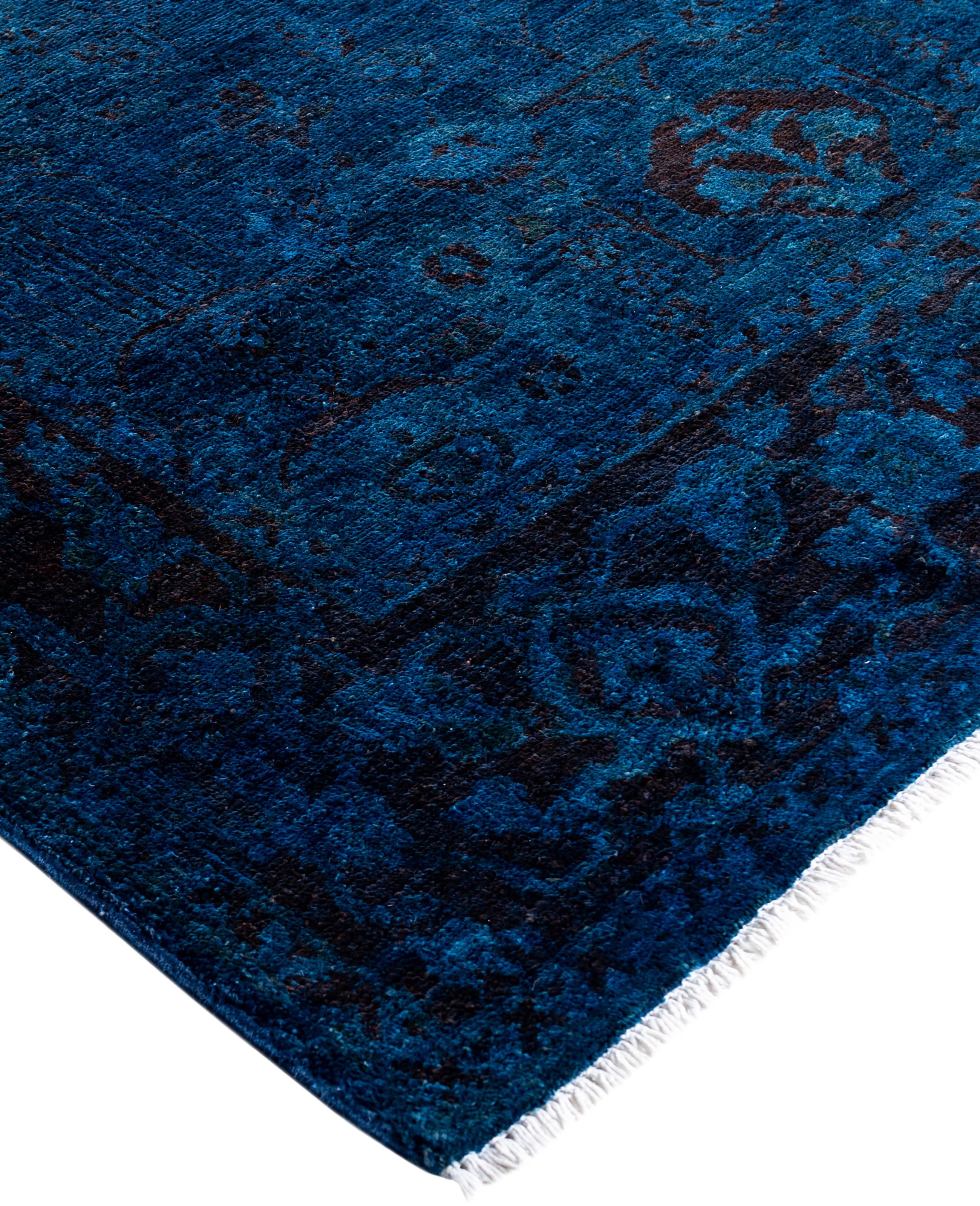 Over-dyed area rugs are created by taking vintage or traditional rugs and applying a vibrant, monochromatic dye over the existing patterns. This technique results in a bold, modern aesthetic while preserving the intricate designs beneath, blending