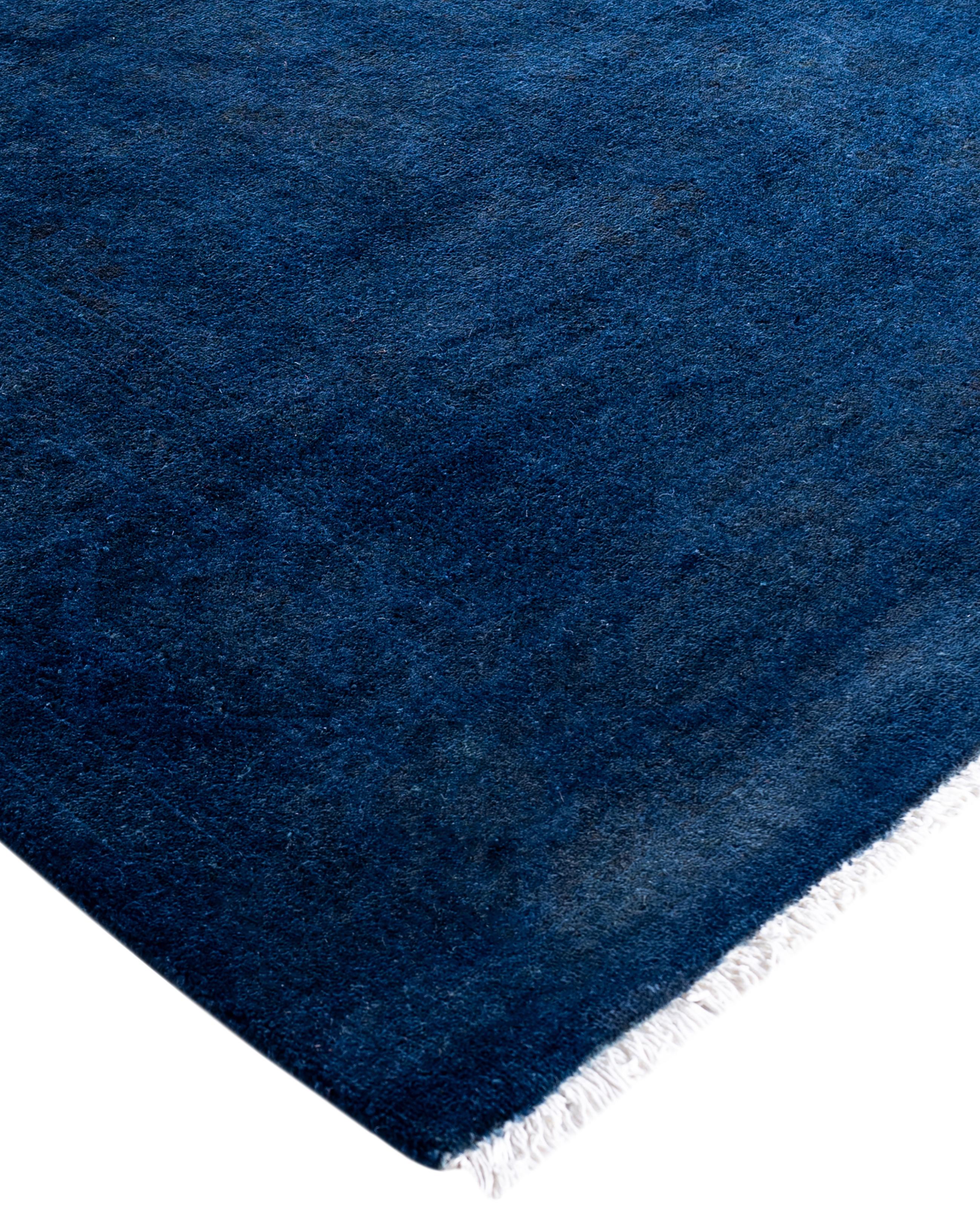 Over-dyed area rugs are created by taking vintage or traditional rugs and applying a vibrant, monochromatic dye over the existing patterns. This technique results in a bold, modern aesthetic while preserving the intricate designs beneath, blending