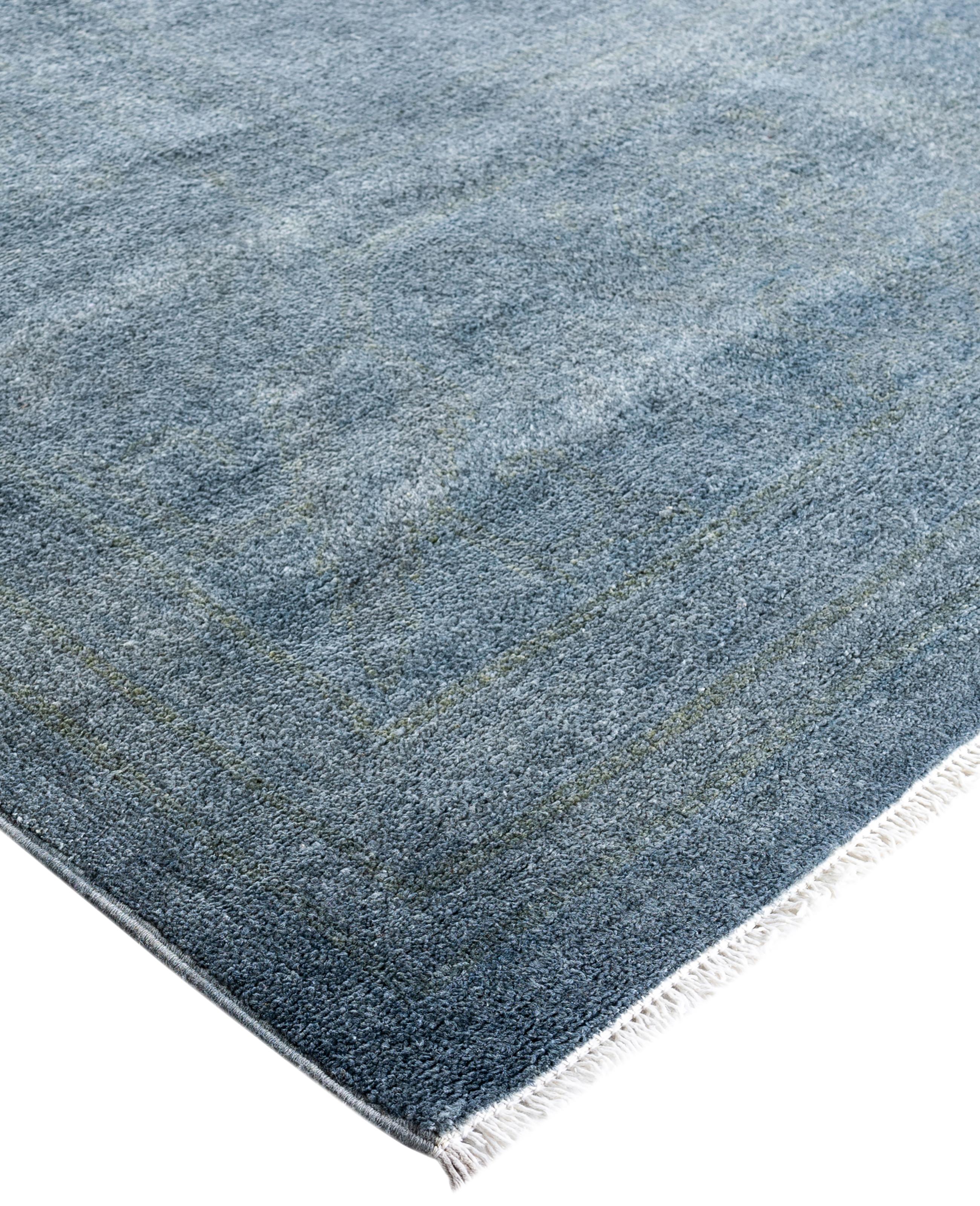 Over-dyed area rugs are created by taking vintage or traditional rugs and applying a vibrant, monochromatic dye over the existing patterns. This technique results in a bold, modern aesthetic while preserving the intricate designs beneath, blending
