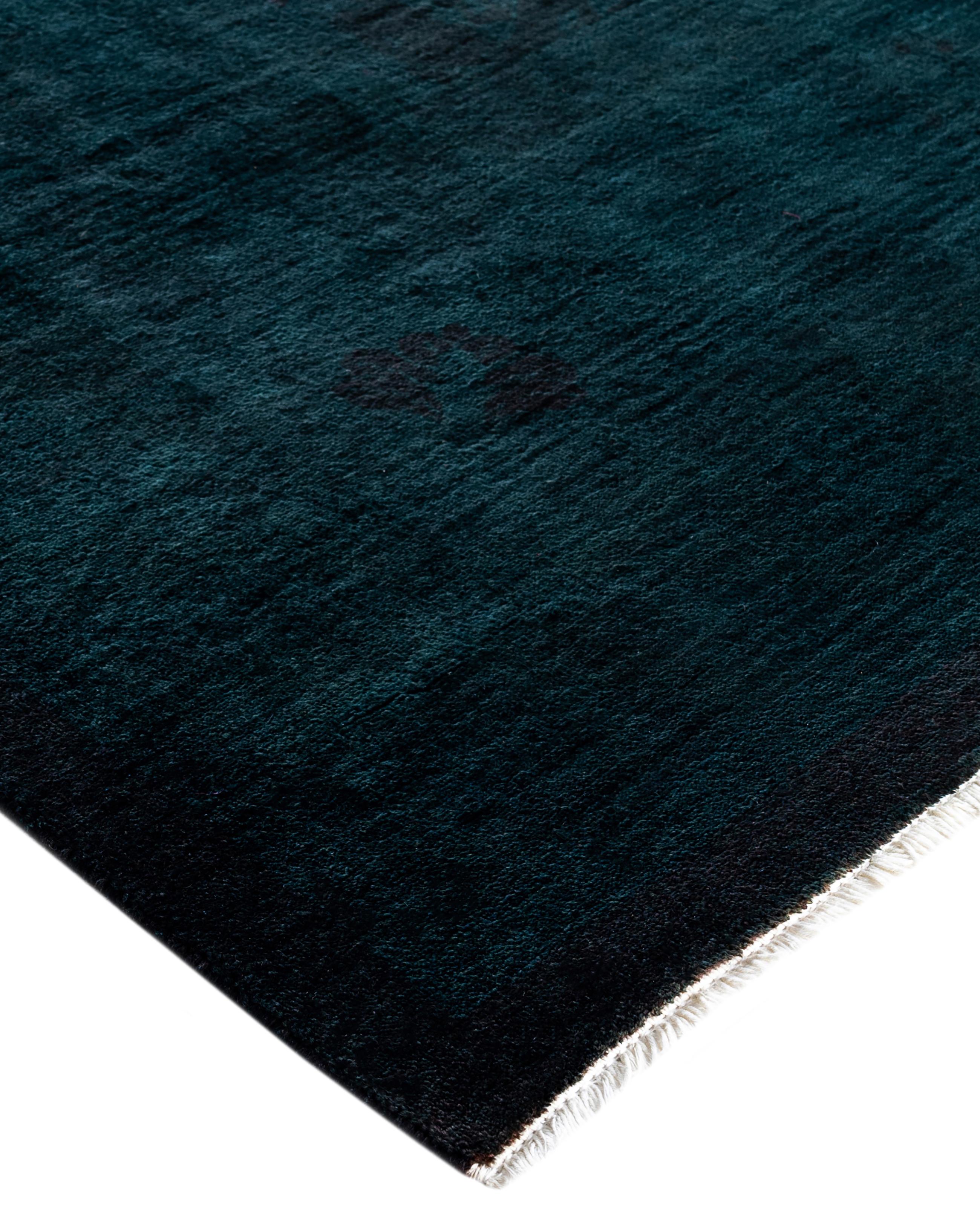 Over-dyed area rugs are created by taking vintage or traditional rugs and applying a vibrant, monochromatic dye over the existing patterns. This technique results in a bold, modern aesthetic while preserving the intricate designs beneath, blending