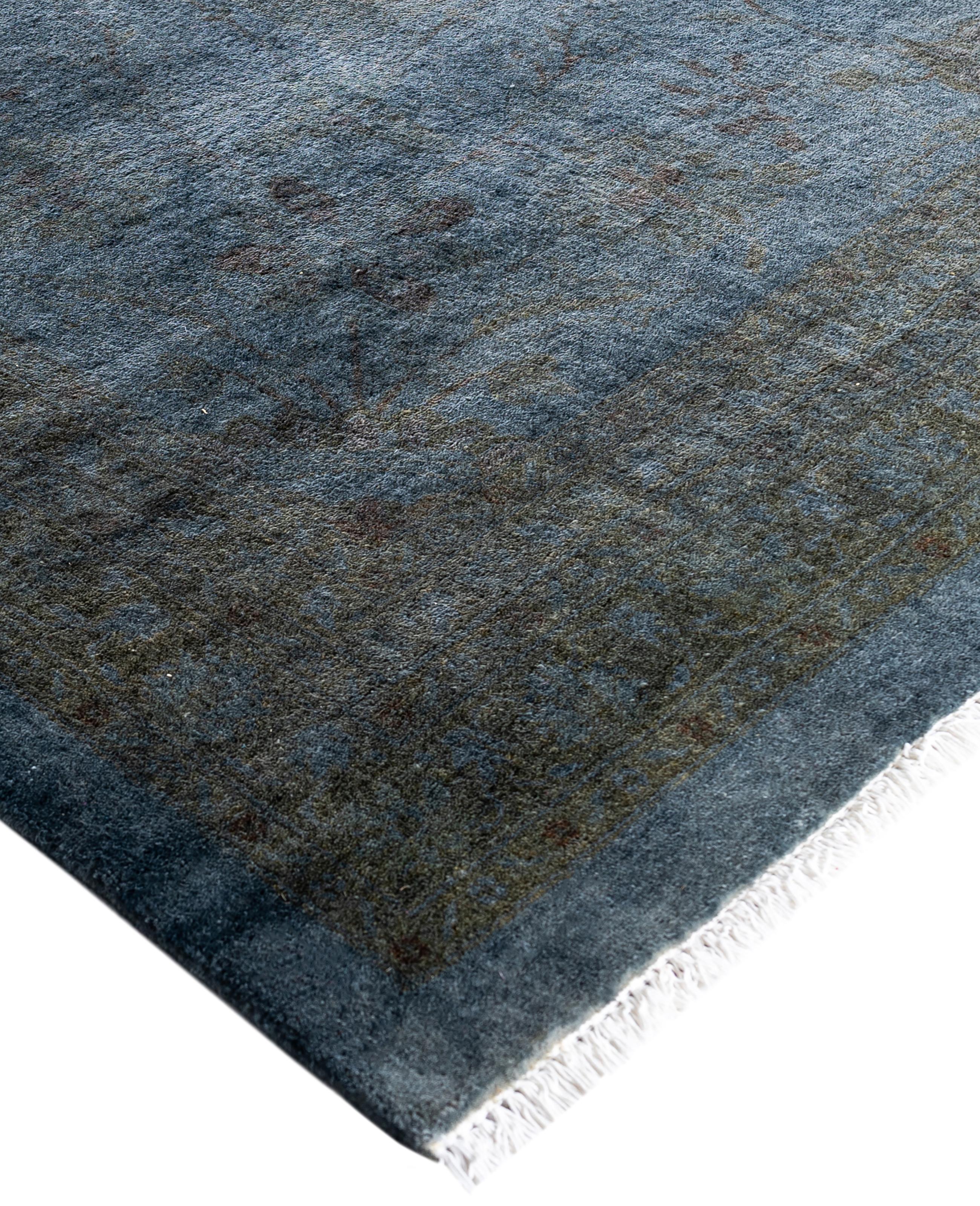 Over-dyed area rugs are created by taking vintage or traditional rugs and applying a vibrant, monochromatic dye over the existing patterns. This technique results in a bold, modern aesthetic while preserving the intricate designs beneath, blending