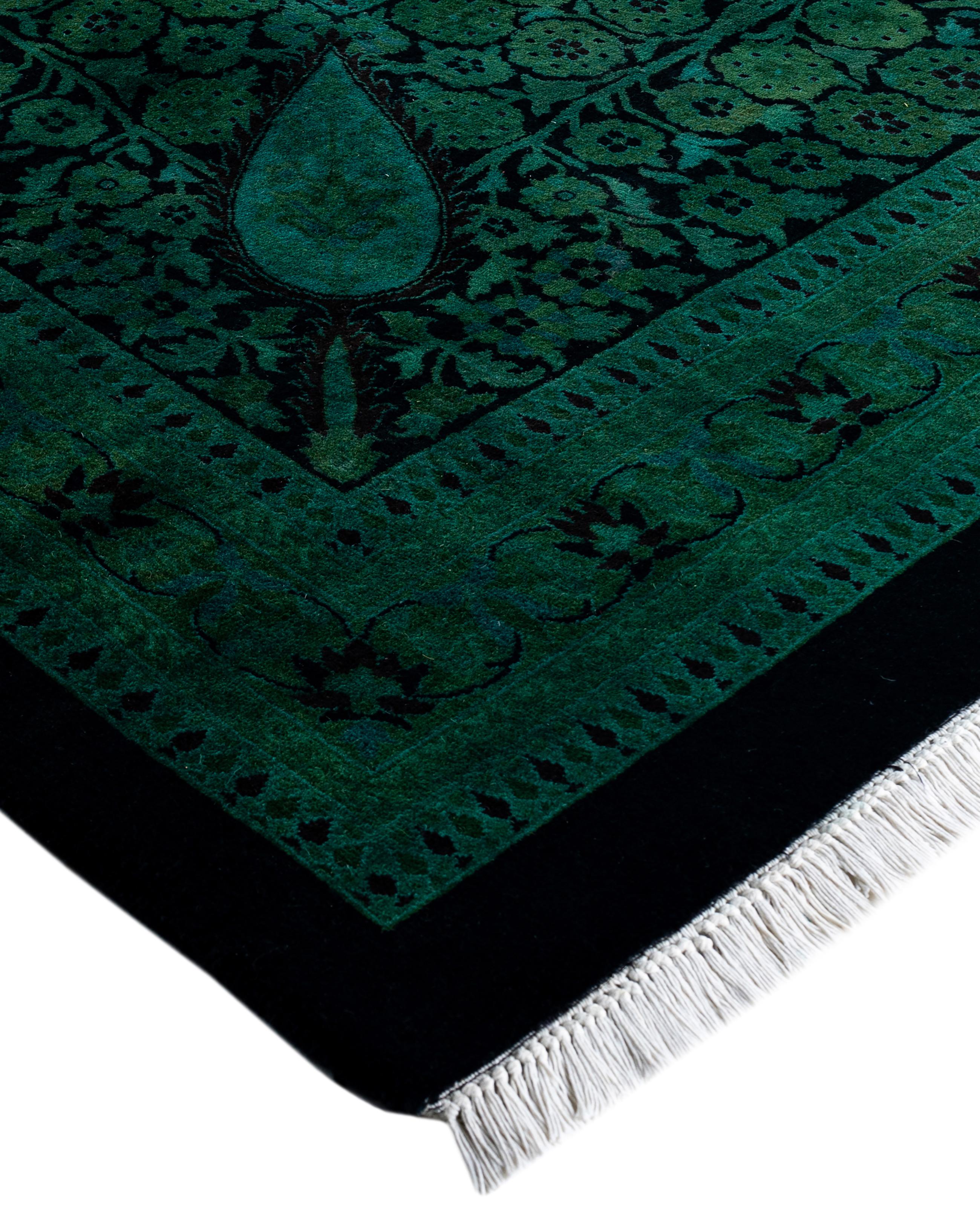 Over-dyed area rugs are created by taking vintage or traditional rugs and applying a vibrant, monochromatic dye over the existing patterns. This technique results in a bold, modern aesthetic while preserving the intricate designs beneath, blending