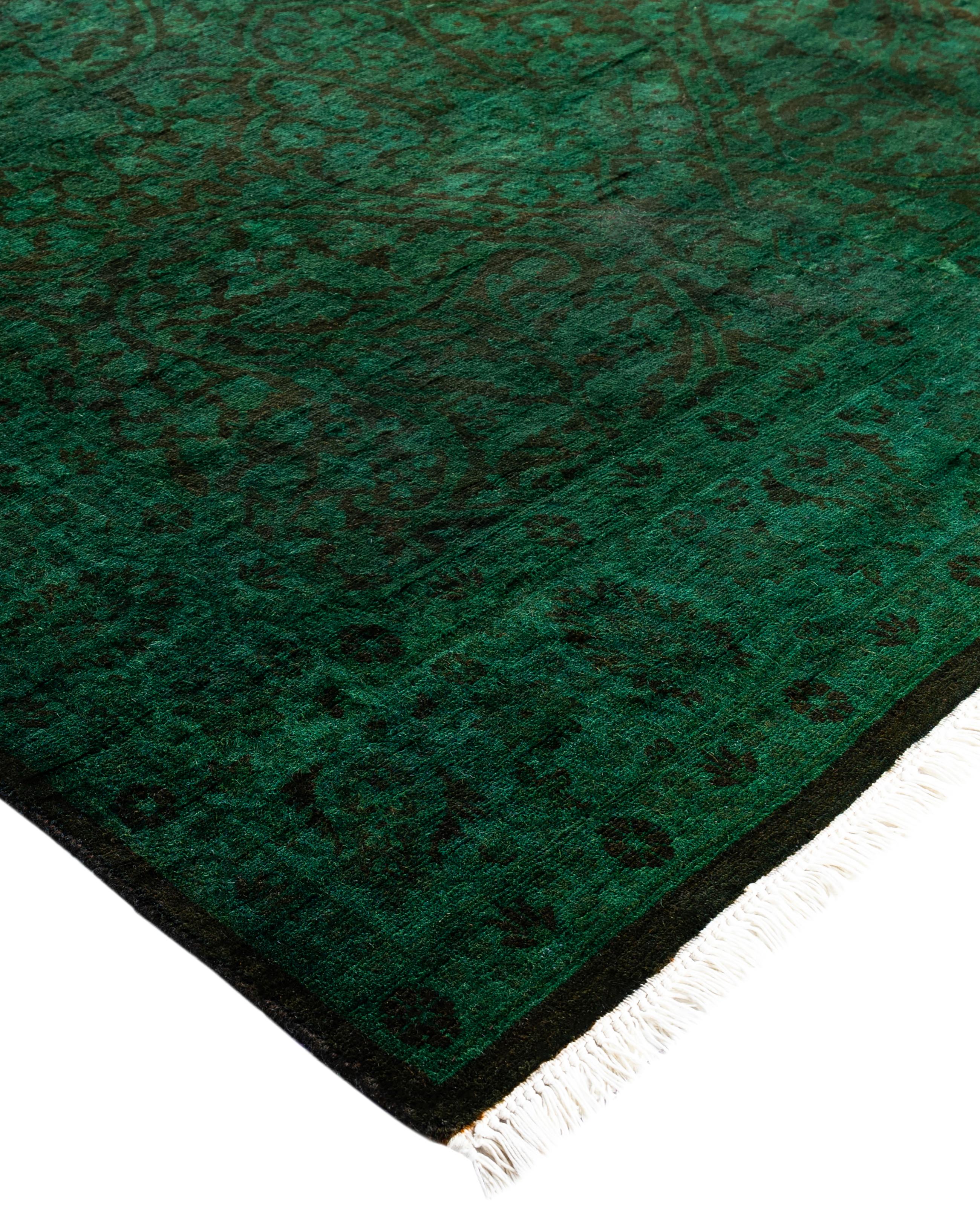 Over-dyed area rugs are created by taking vintage or traditional rugs and applying a vibrant, monochromatic dye over the existing patterns. This technique results in a bold, modern aesthetic while preserving the intricate designs beneath, blending