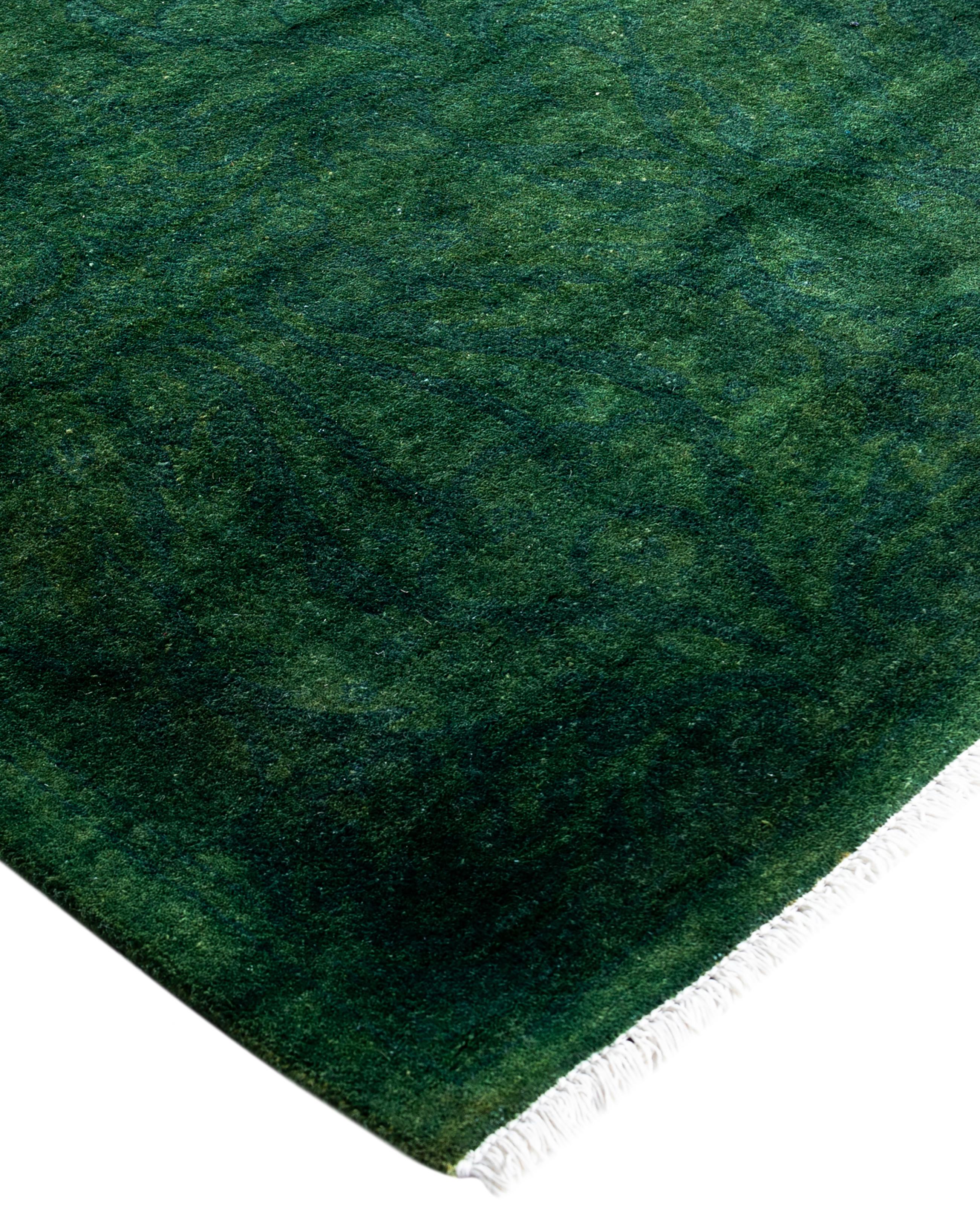Over-dyed area rugs are created by taking vintage or traditional rugs and applying a vibrant, monochromatic dye over the existing patterns. This technique results in a bold, modern aesthetic while preserving the intricate designs beneath, blending