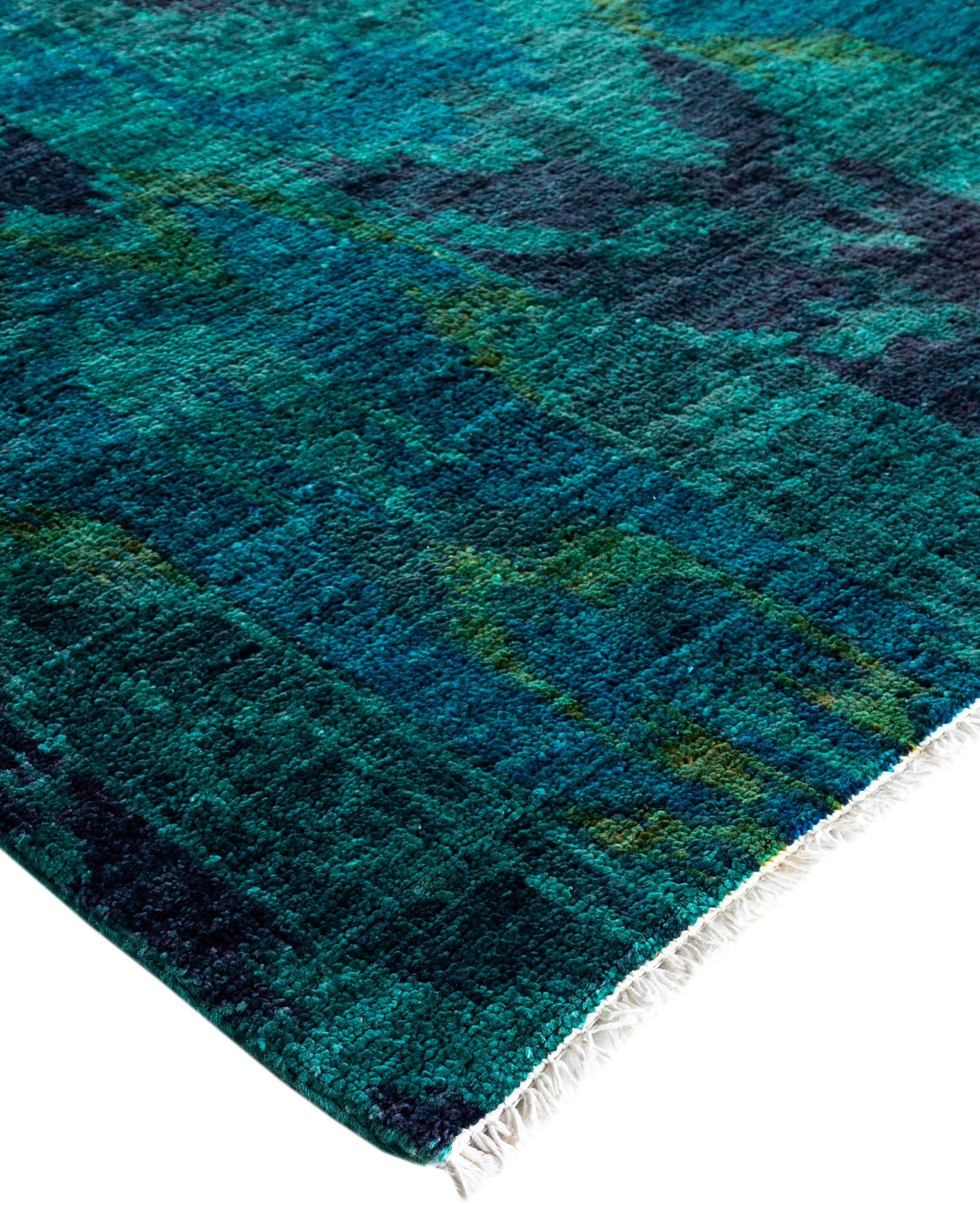 Over-dyed area rugs are created by taking vintage or traditional rugs and applying a vibrant, monochromatic dye over the existing patterns. This technique results in a bold, modern aesthetic while preserving the intricate designs beneath, blending