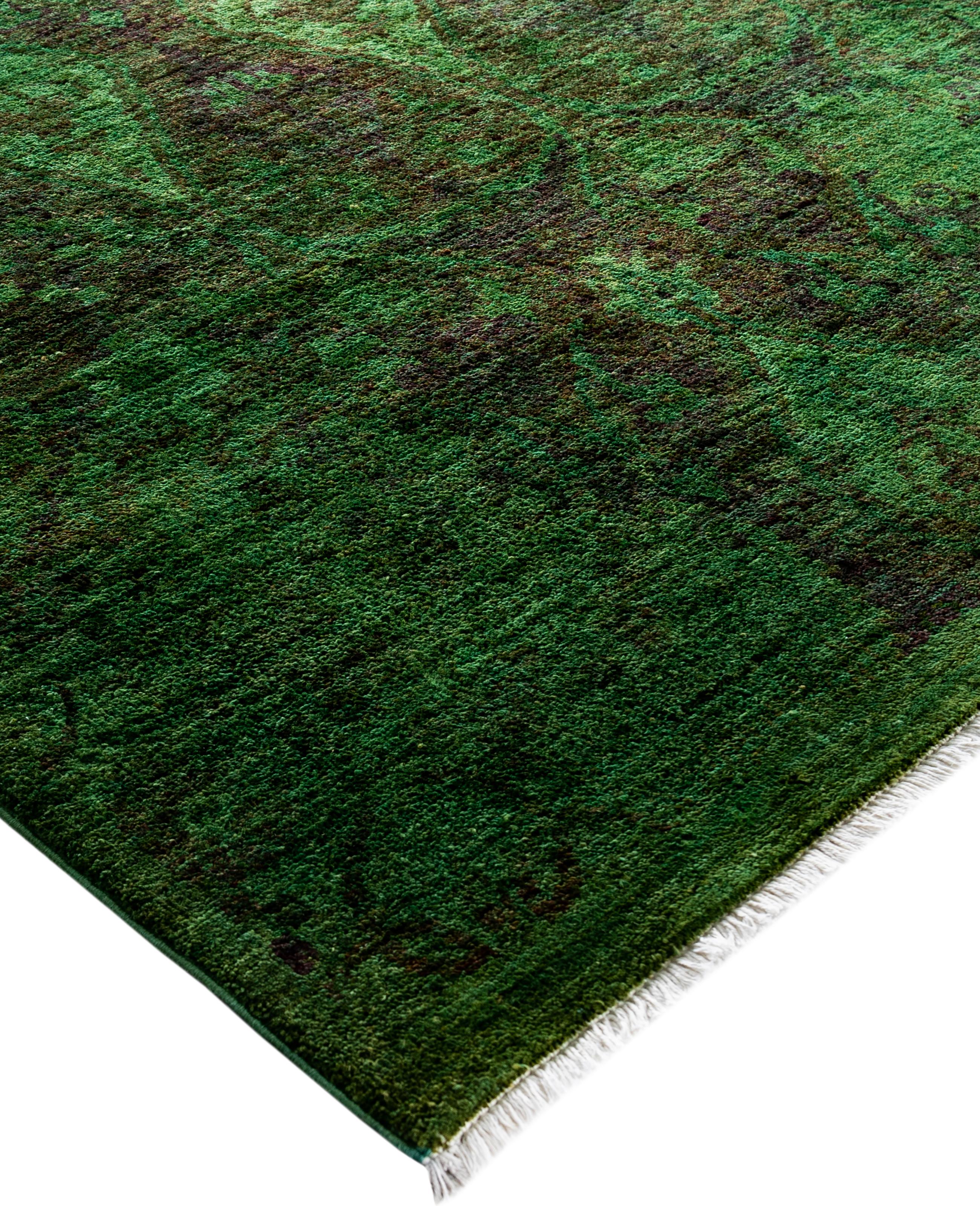 Over-dyed area rugs are created by taking vintage or traditional rugs and applying a vibrant, monochromatic dye over the existing patterns. This technique results in a bold, modern aesthetic while preserving the intricate designs beneath, blending