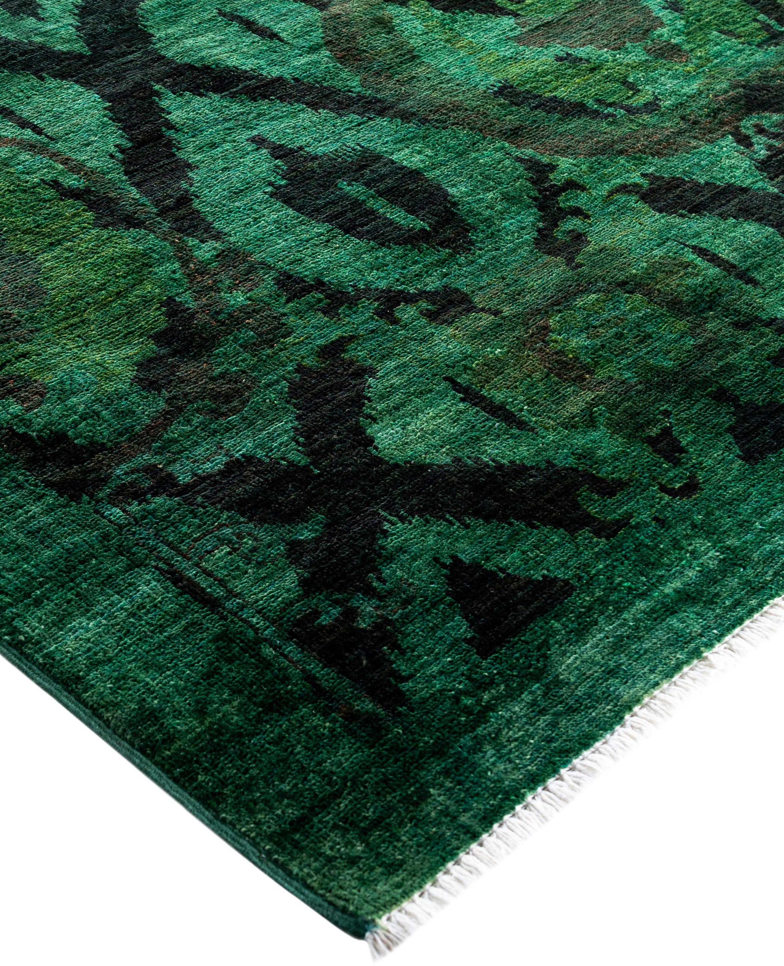 Over-dyed area rugs are created by taking vintage or traditional rugs and applying a vibrant, monochromatic dye over the existing patterns. This technique results in a bold, modern aesthetic while preserving the intricate designs beneath, blending