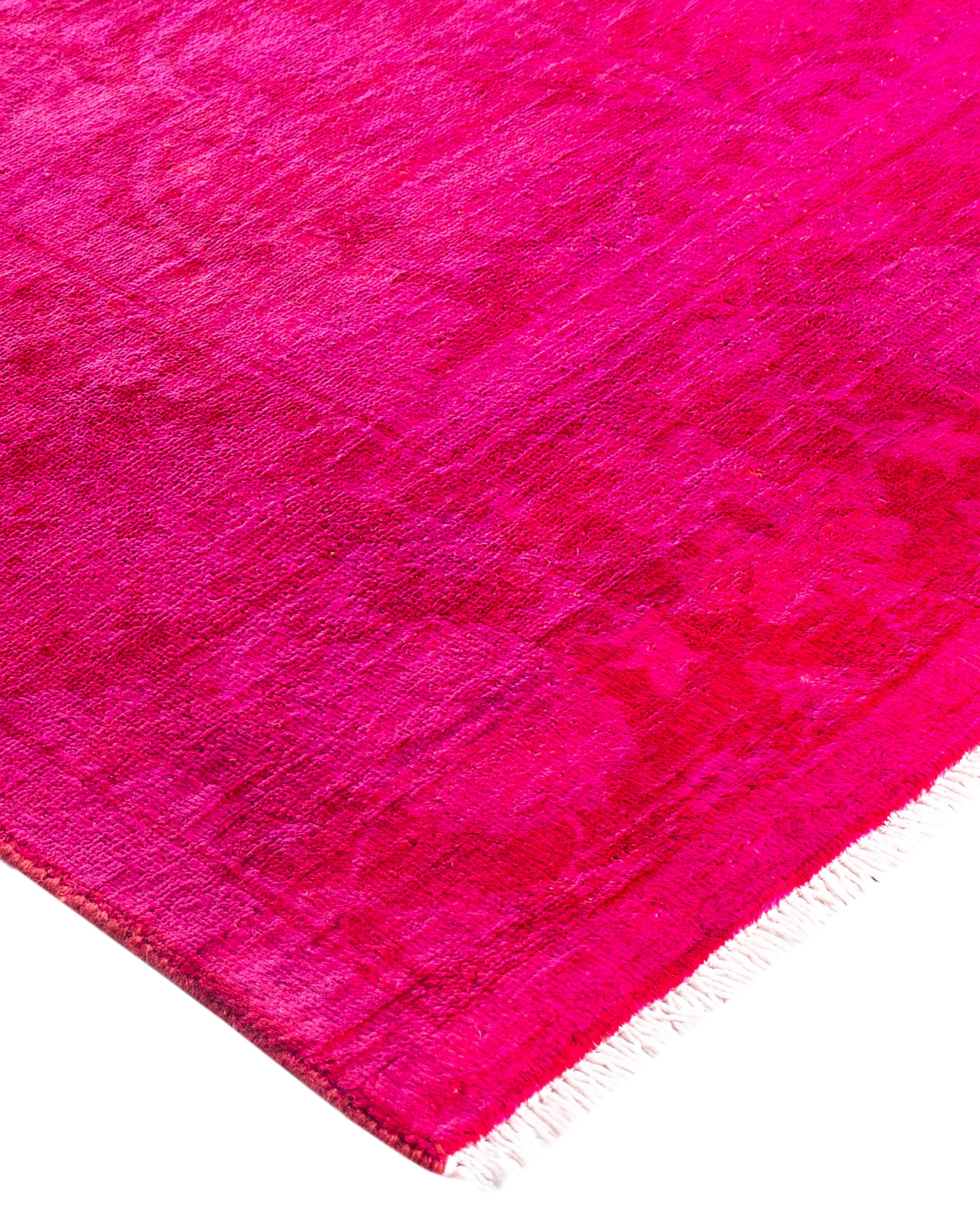 Over-dyed area rugs are created by taking vintage or traditional rugs and applying a vibrant, monochromatic dye over the existing patterns. This technique results in a bold, modern aesthetic while preserving the intricate designs beneath, blending