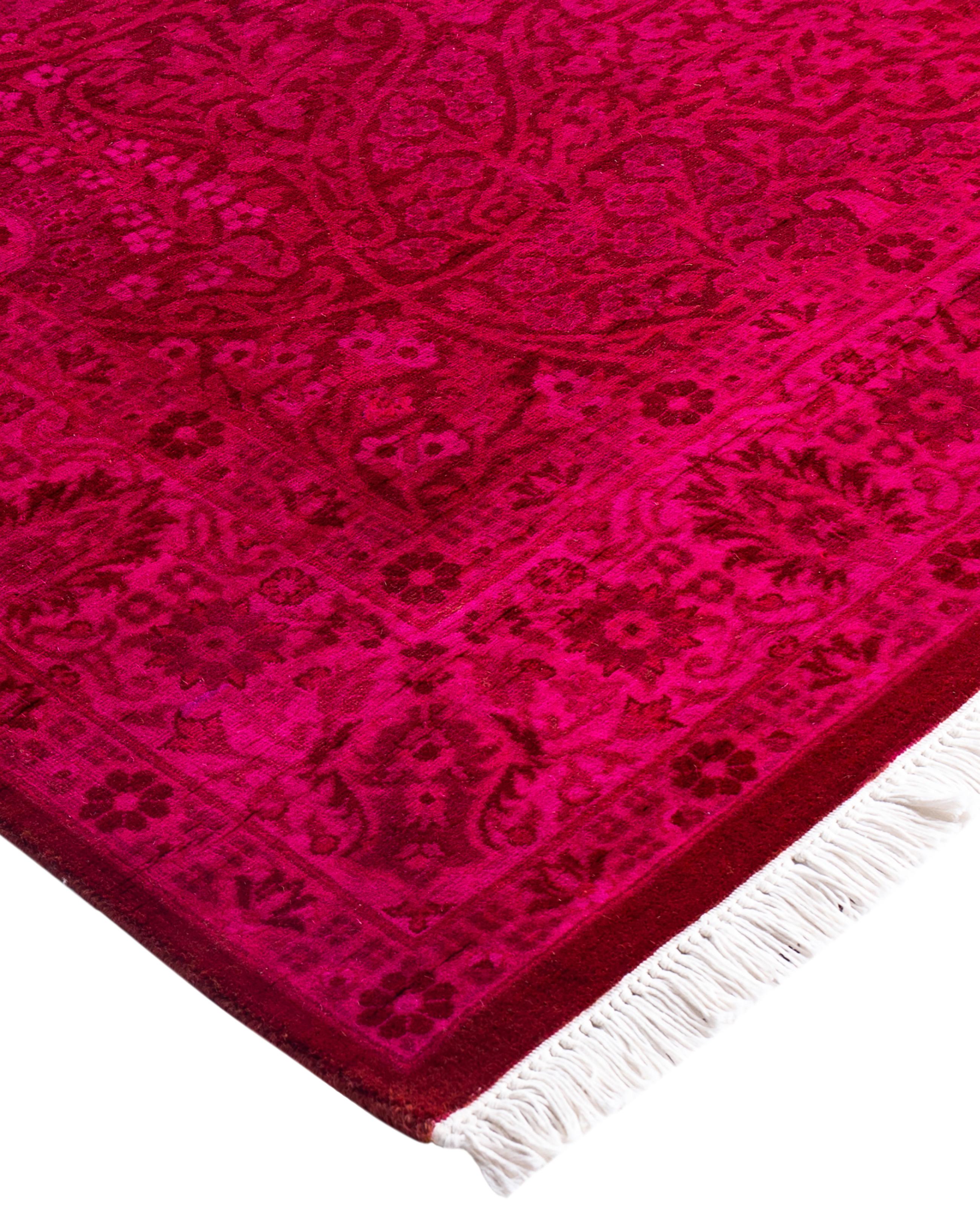 Over-dyed area rugs are created by taking vintage or traditional rugs and applying a vibrant, monochromatic dye over the existing patterns. This technique results in a bold, modern aesthetic while preserving the intricate designs beneath, blending
