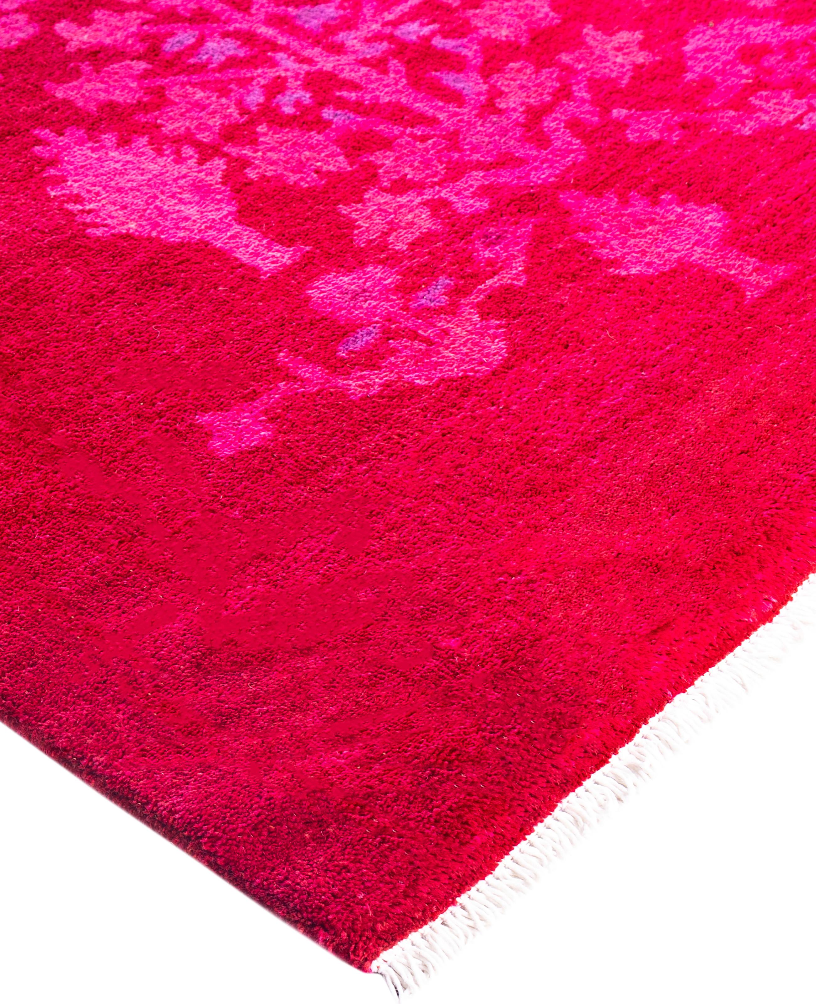 Over-dyed area rugs are created by taking vintage or traditional rugs and applying a vibrant, monochromatic dye over the existing patterns. This technique results in a bold, modern aesthetic while preserving the intricate designs beneath, blending