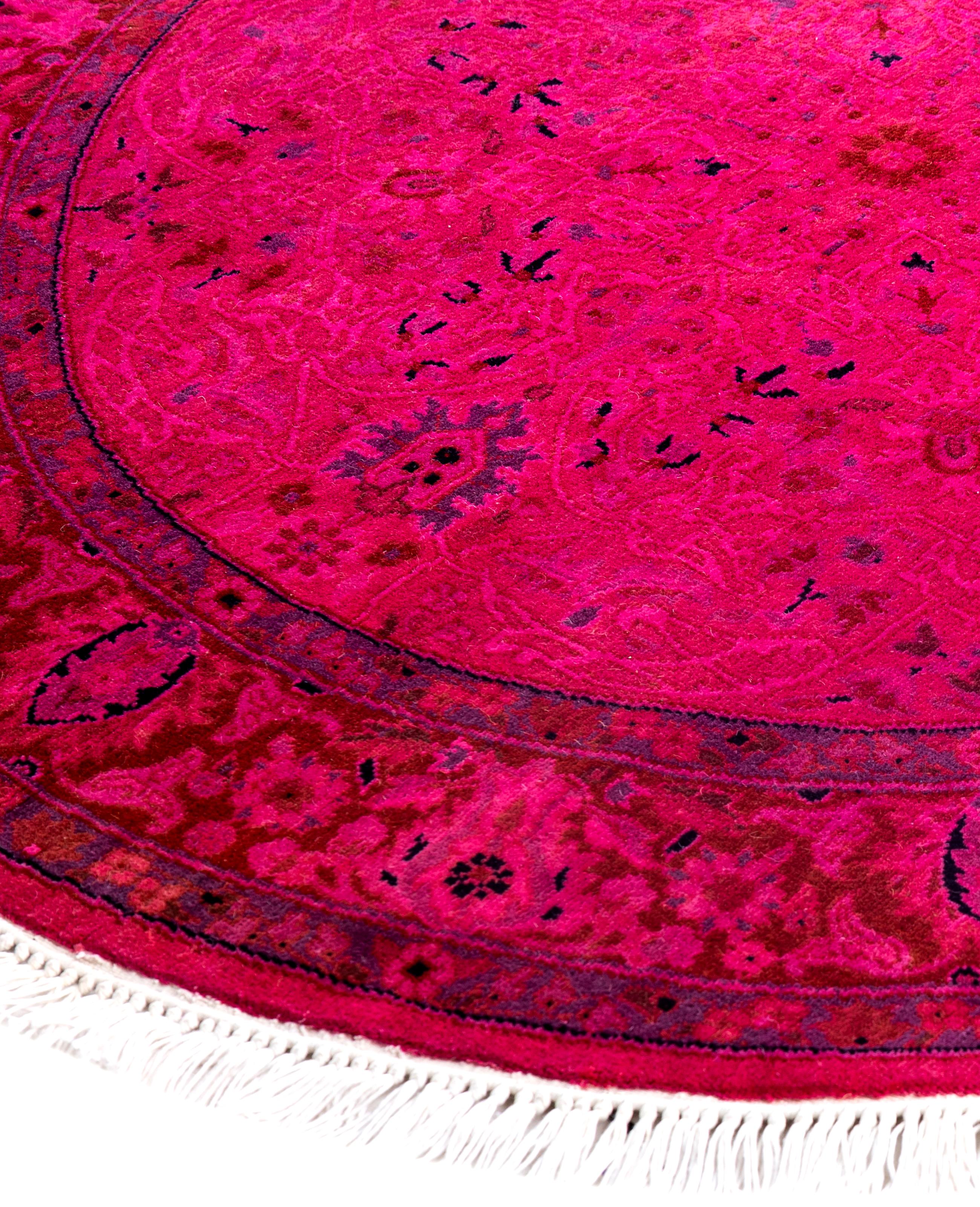 Over-dyed area rugs are created by taking vintage or traditional rugs and applying a vibrant, monochromatic dye over the existing patterns. This technique results in a bold, modern aesthetic while preserving the intricate designs beneath, blending