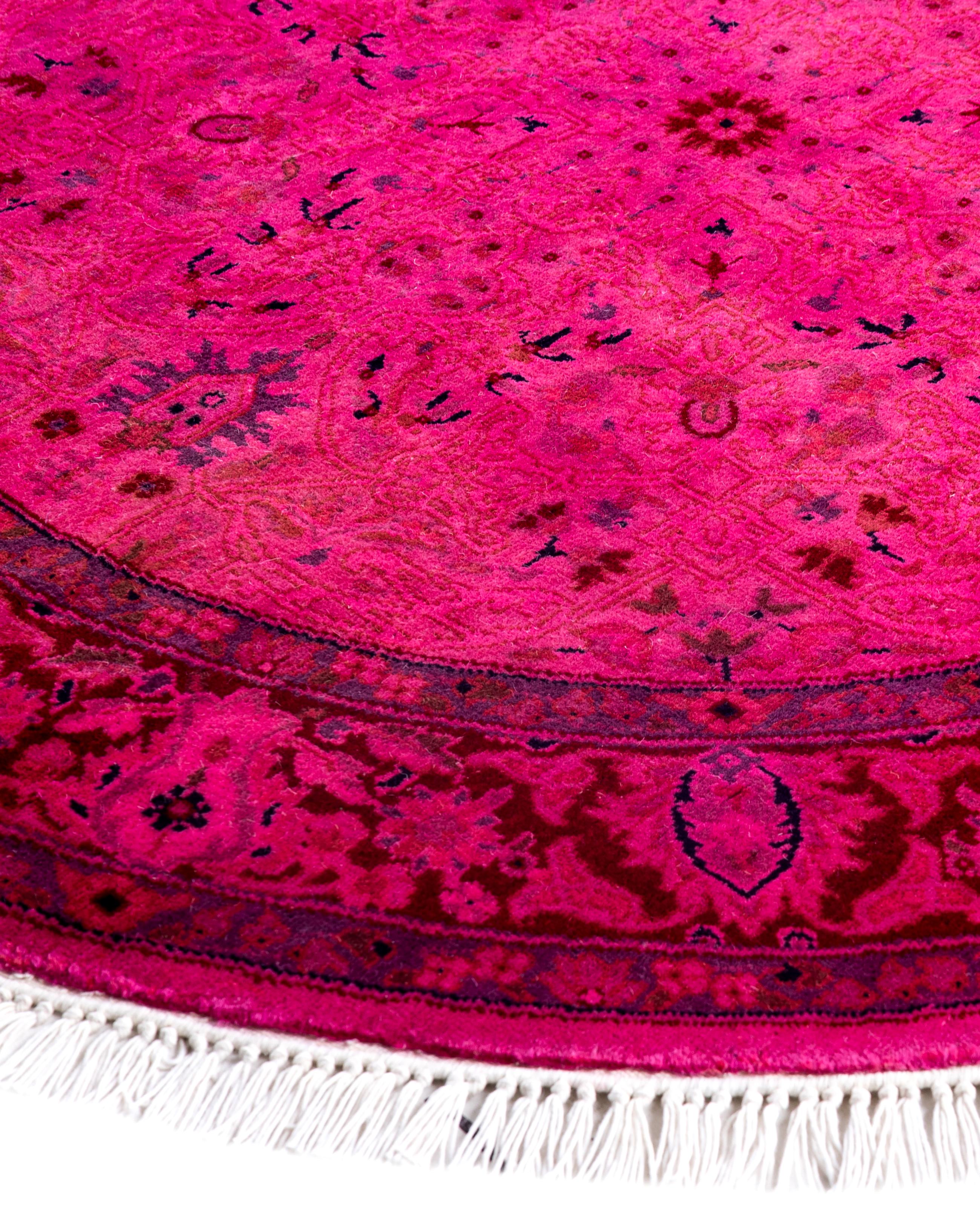 Over-dyed area rugs are created by taking vintage or traditional rugs and applying a vibrant, monochromatic dye over the existing patterns. This technique results in a bold, modern aesthetic while preserving the intricate designs beneath, blending