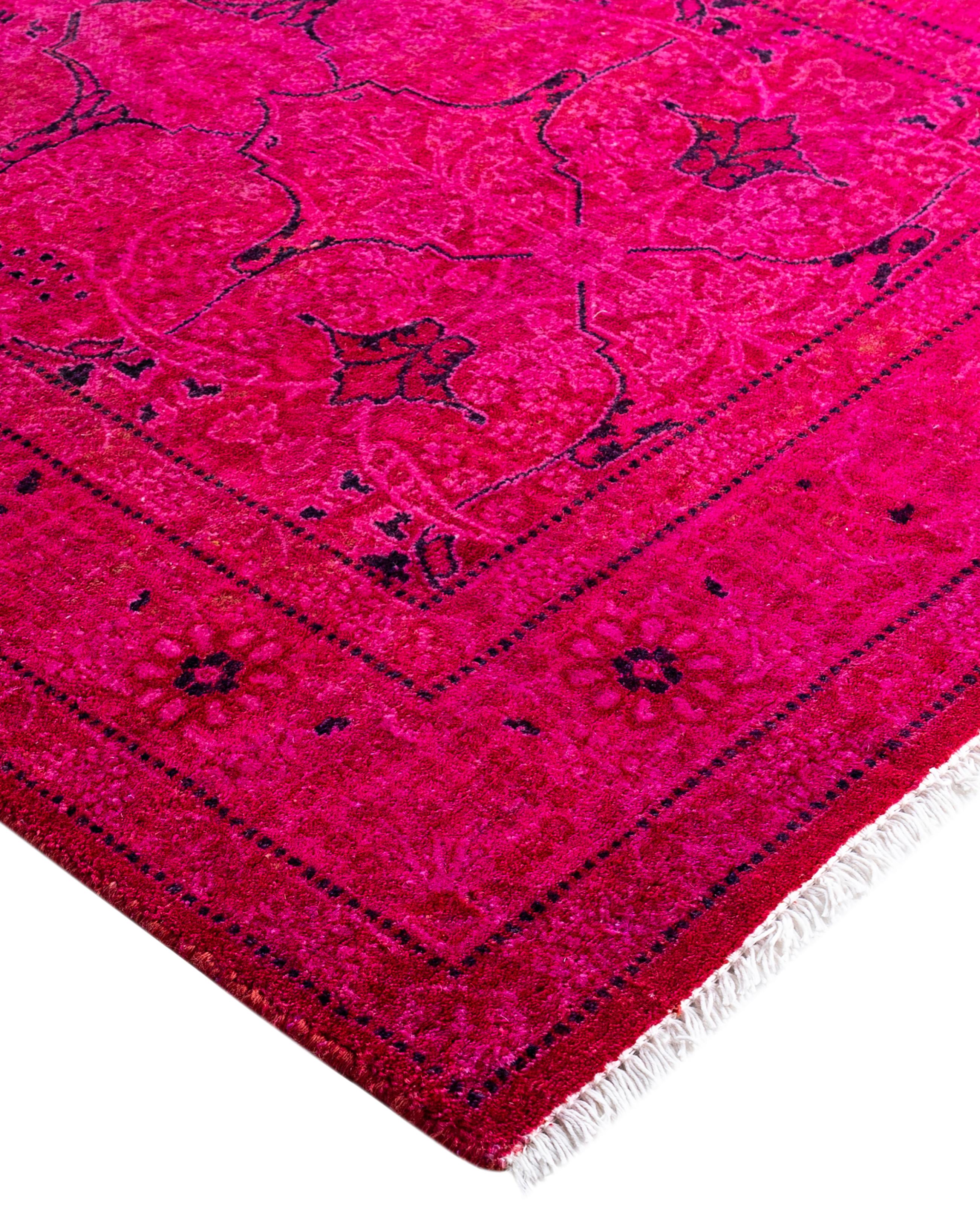 Over-dyed area rugs are created by taking vintage or traditional rugs and applying a vibrant, monochromatic dye over the existing patterns. This technique results in a bold, modern aesthetic while preserving the intricate designs beneath, blending