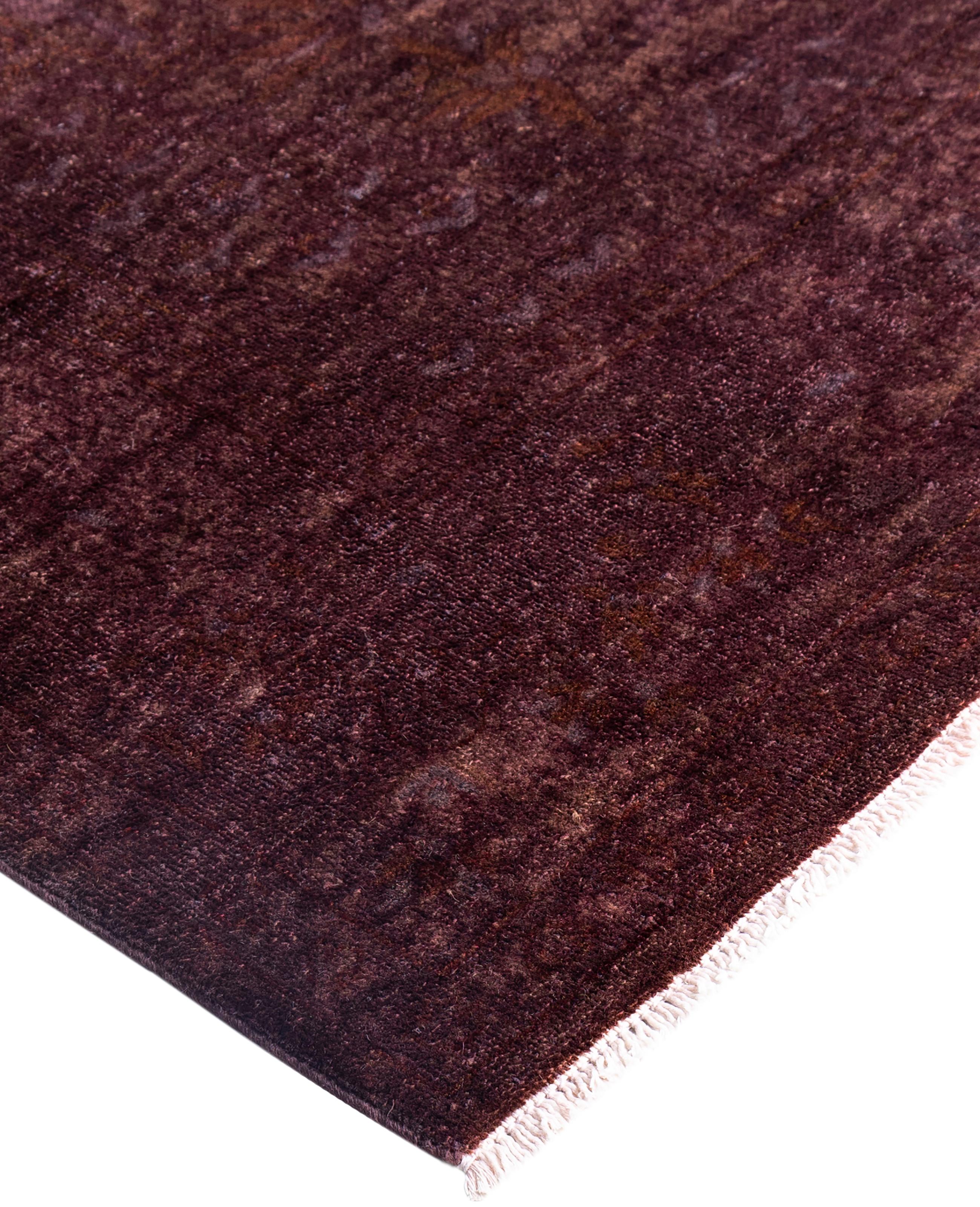 Over-dyed area rugs are created by taking vintage or traditional rugs and applying a vibrant, monochromatic dye over the existing patterns. This technique results in a bold, modern aesthetic while preserving the intricate designs beneath, blending