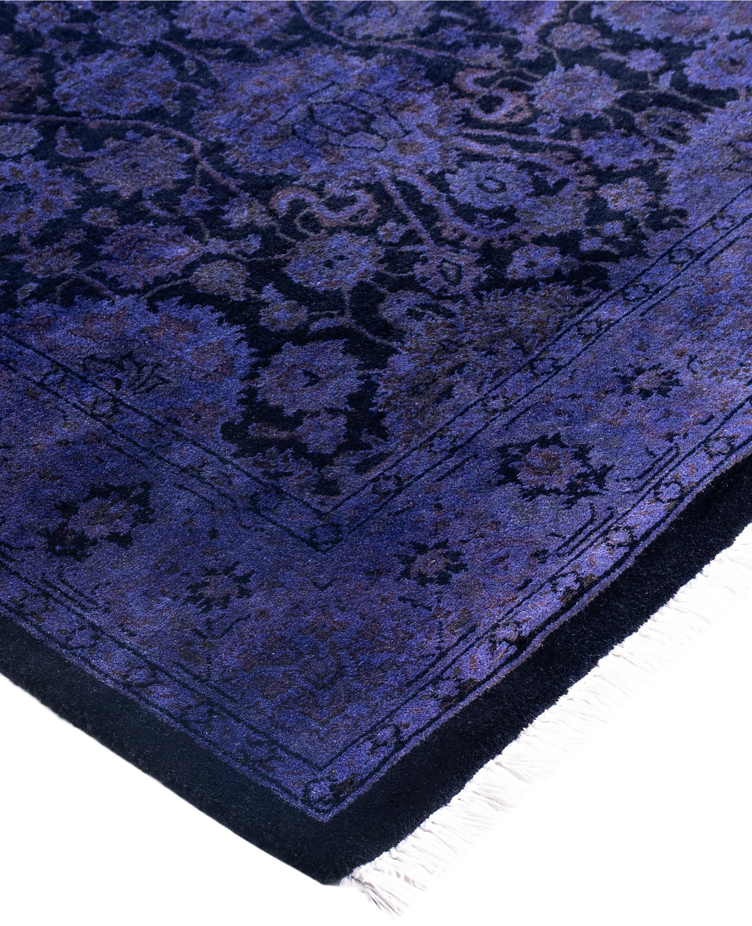 Over-dyed area rugs are created by taking vintage or traditional rugs and applying a vibrant, monochromatic dye over the existing patterns. This technique results in a bold, modern aesthetic while preserving the intricate designs beneath, blending