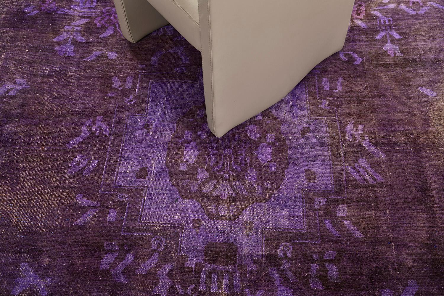 A great way to feel traditional flooring and looks more modern and contemporary style with this type of Anatolian rug. A blue purple-toned background is well coordinated with a black pigment vine pattern at the center. This overdyed Anatolian design