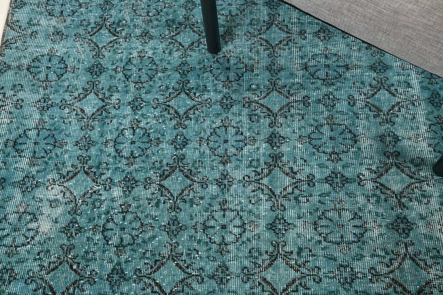 A great way to feel a traditional carpet and looks more modern and contemporary style in this type of Anatolian rug. A vibrant cerulean blue is well coordinated with repetitive patterns. This overdyed Anatolian design rug is a perfect choice for