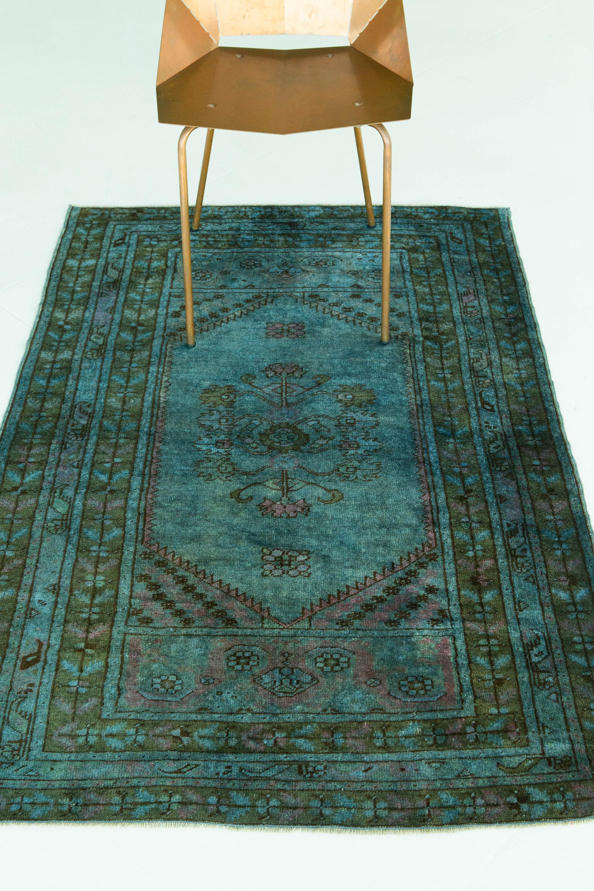 A Vintage blue Turkish Anatolian overdyed rug that will bring personality to any space. Anatolian rugs weave together dyes and colours, motifs, textures and techniques that are popular in Anatolia or Asia Minor. Such techniques include the central
