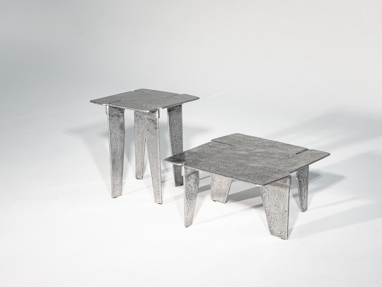 Made in Italy

Overlap coffee table is obtained through metal casting into sand molds. Four cavities on the top, one for each side, envelope the legs that support the rectangular top with rounded corners. The sculptural look of its surface makes