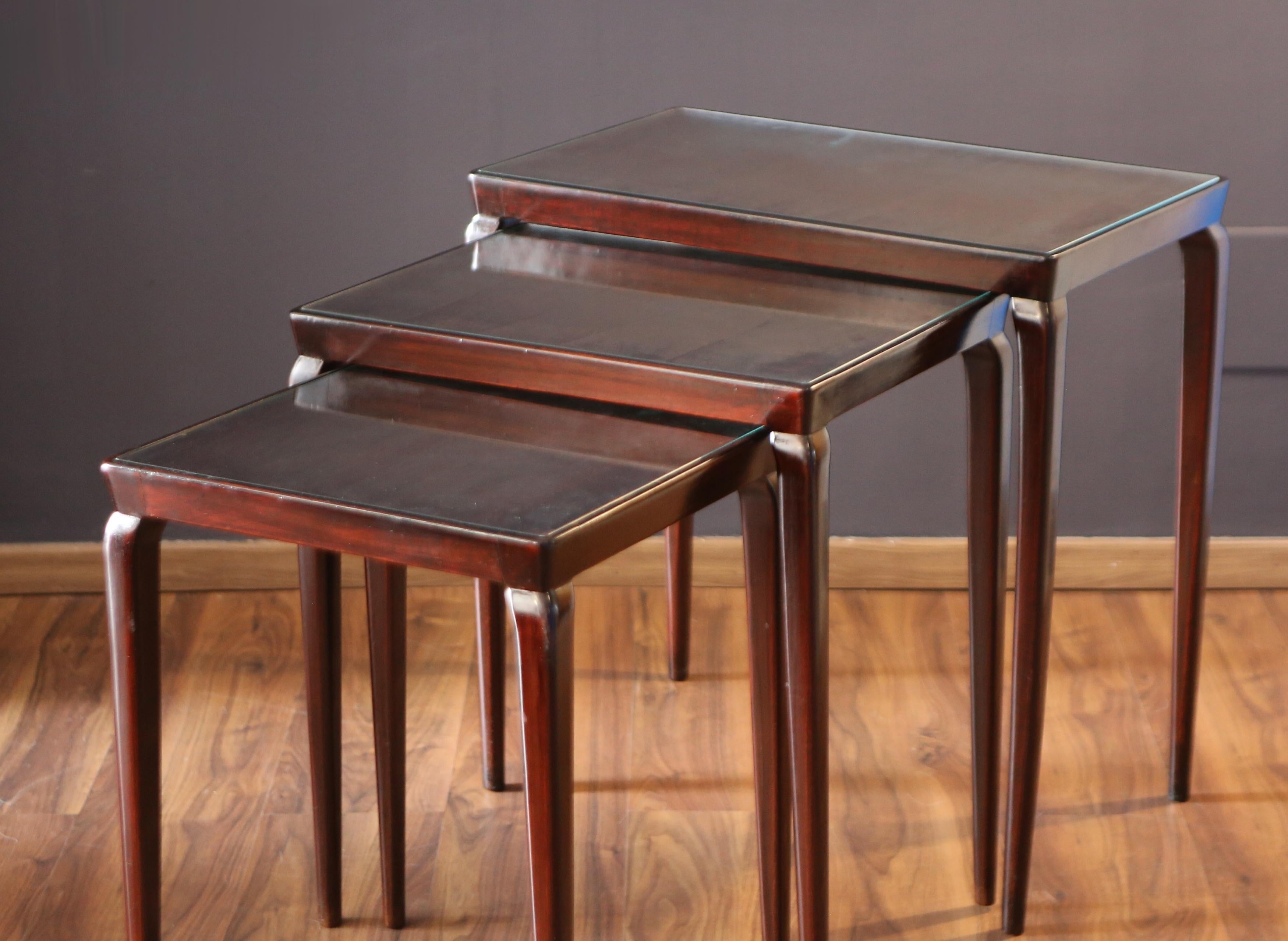 Osvaldo Borsani.
Three nesting tables in walnut wood.
Production 