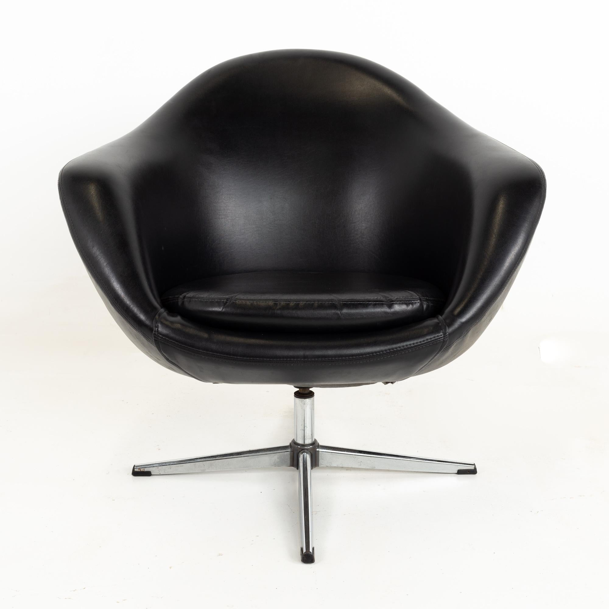 Overman pod Mid Century black swivel lounge chair
This chair is 32.75 wide x 29 deep x 31 inches high, with a seat height of 16.5 and arm height of 23.25 inches

This piece is available in what we call restored vintage condition. Upon purchase it is