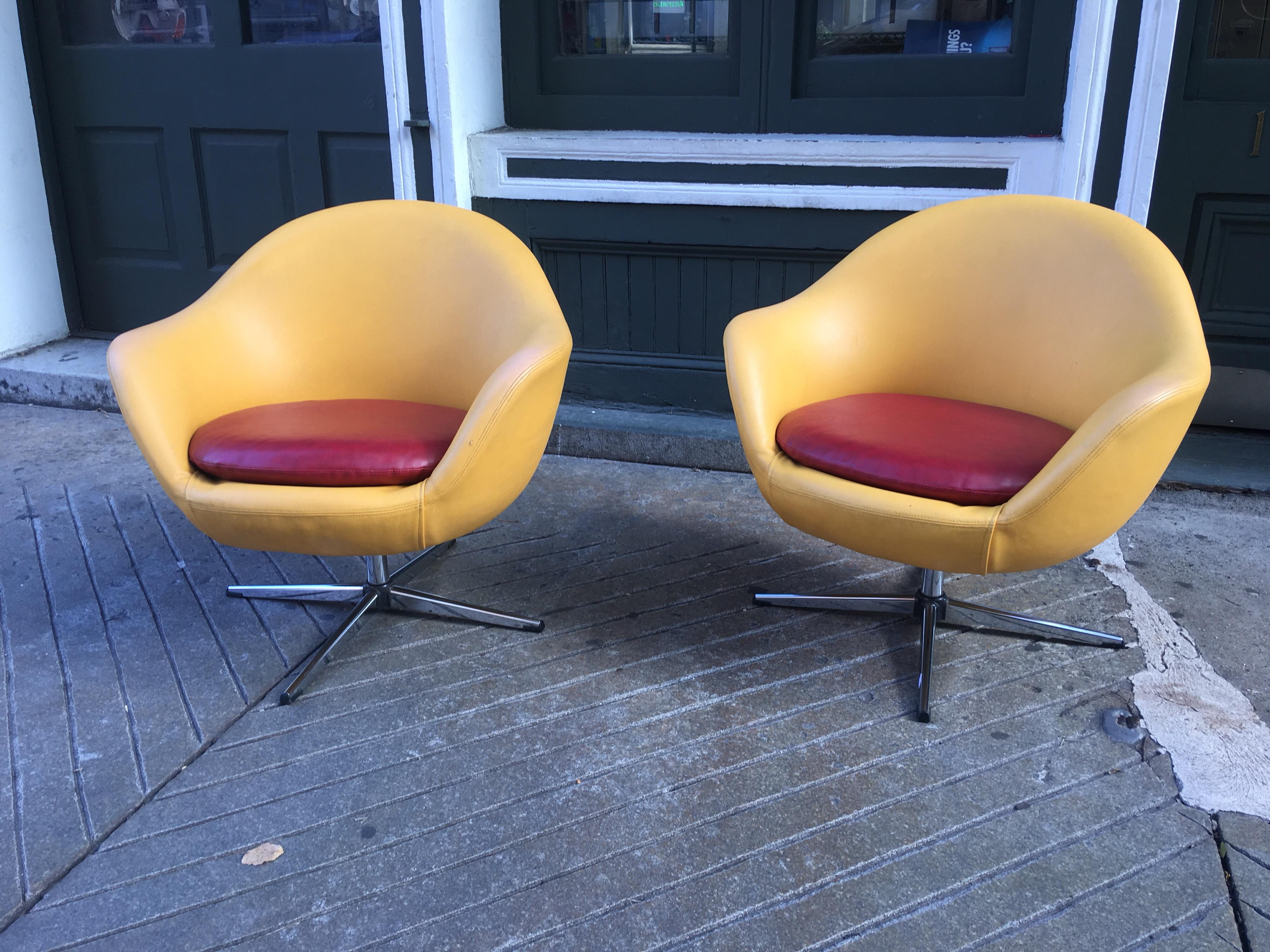 Overman Swivel chairs from Sweden in unusual original color combination. One chair retains an Overman label. One chair has some chrome loss (shown) on splayed leg and one chair has very minor slit in vinyl in the arm (shown).