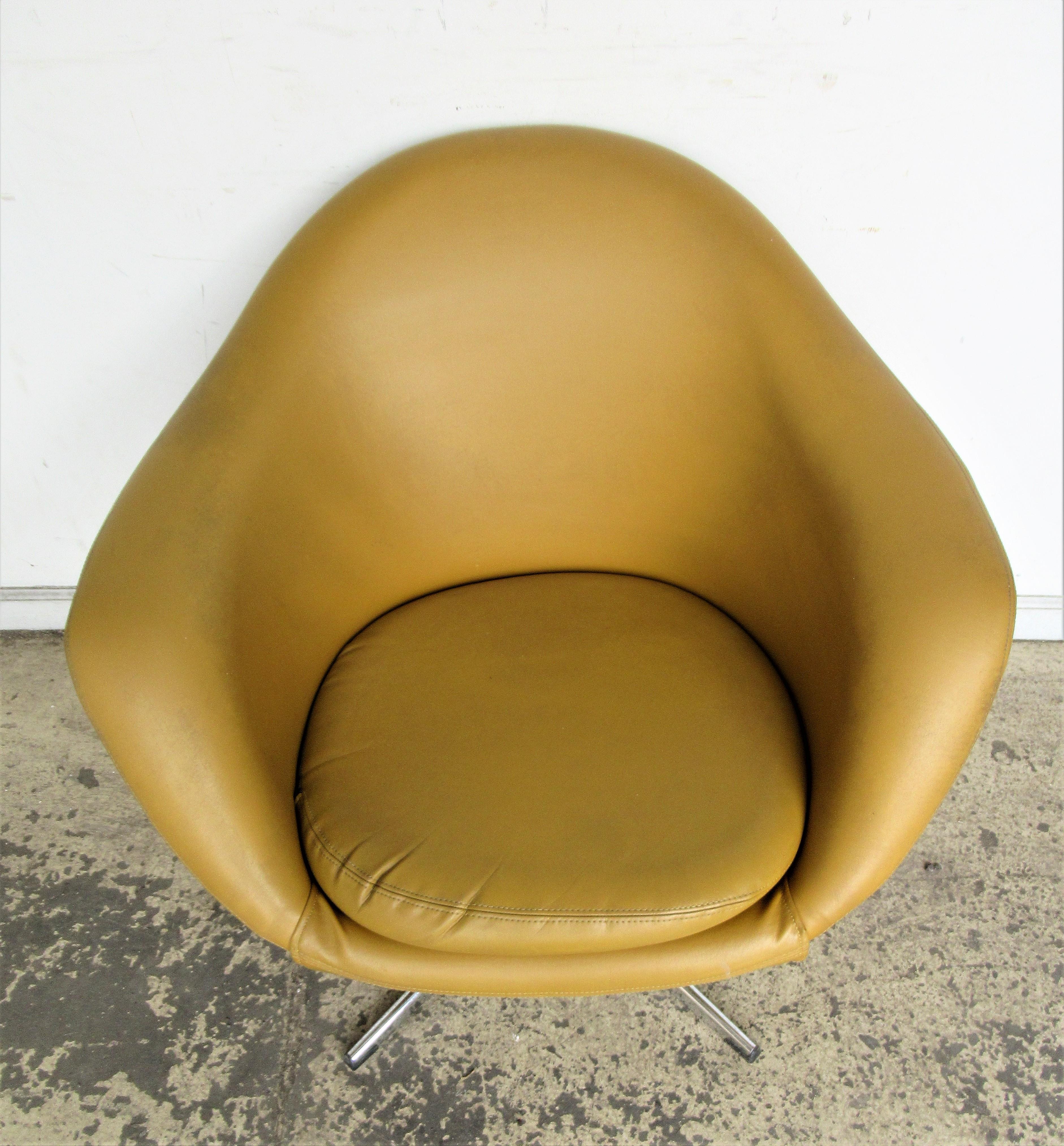 Swivel pod chair by Overman in the original mustard gold vinyl upholstery. Label on seat, circa 1960. Look at all pictures and read the condition report in comment section.