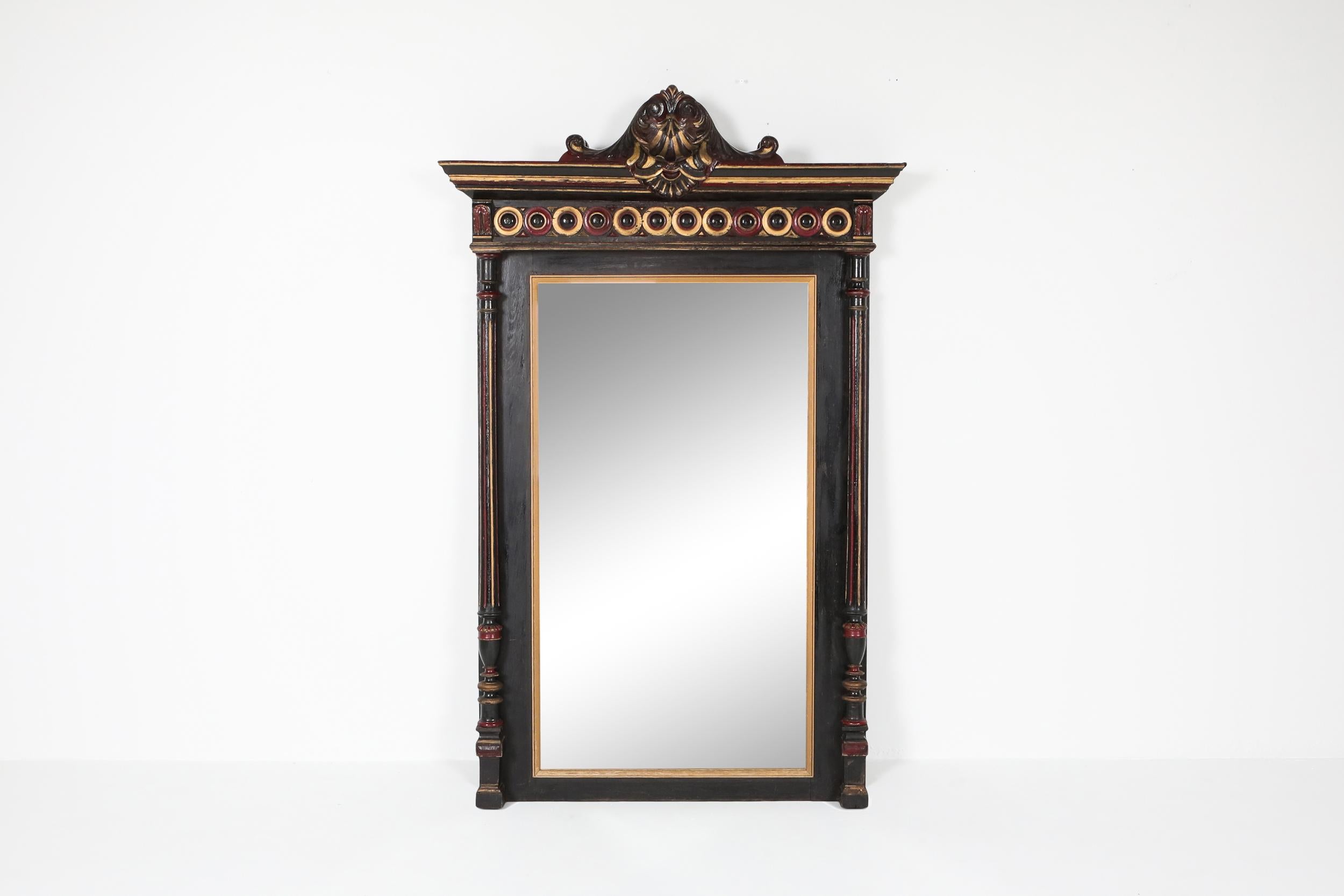 Mirror

This 19th century piece is hand carved and hand painted, showing stunning shapes and details. The color combination; black, gold and royal red give this piece an extraordinary rich appearance.