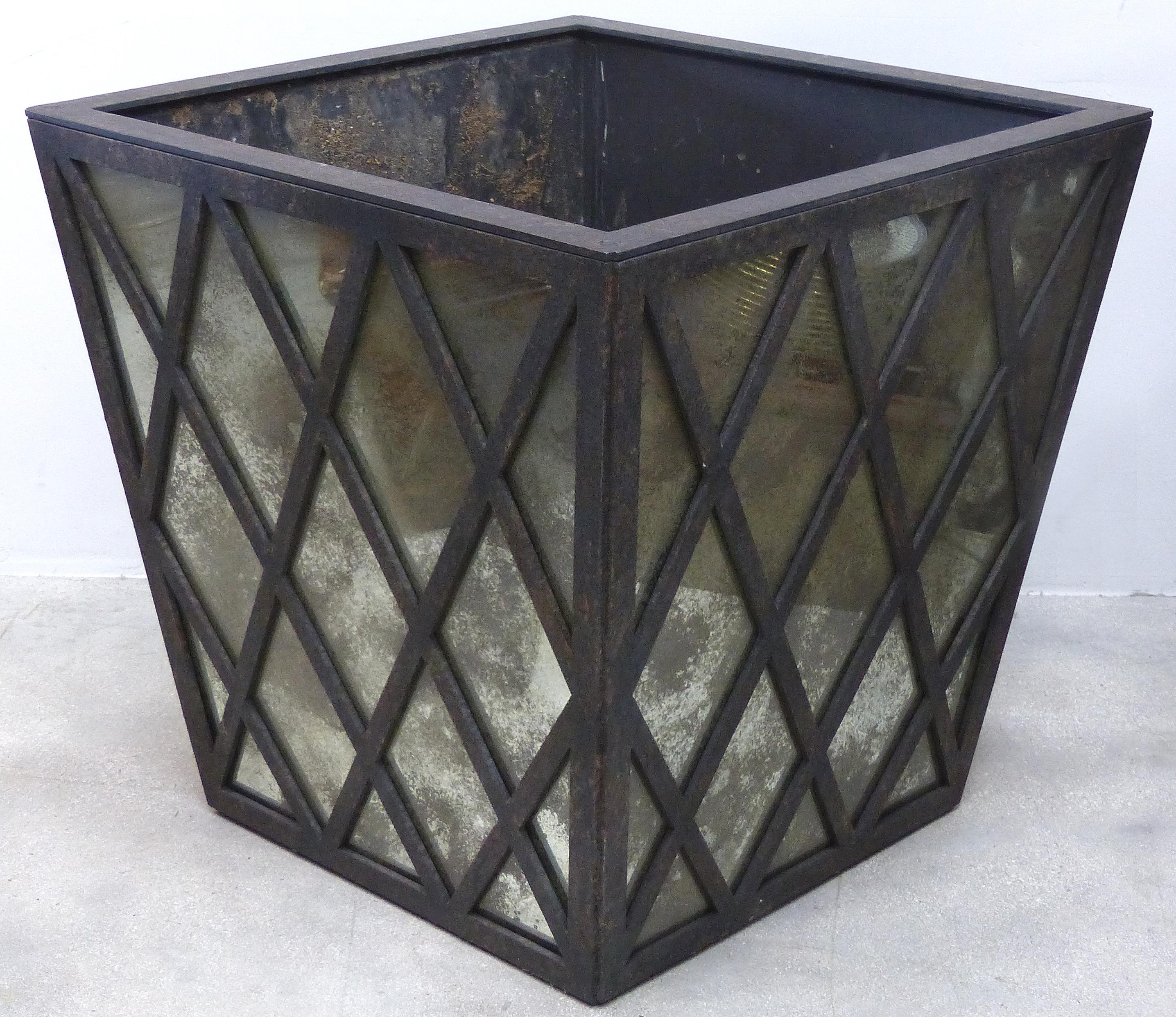 Overscale and Substantial Iron and Aged Glass Planter

Offered for sale is a large and decorative vintage planter handmade of joined iron in a lattice motif with aged mirrored sides. The interior is a metal as the mirror is on the exterior. These