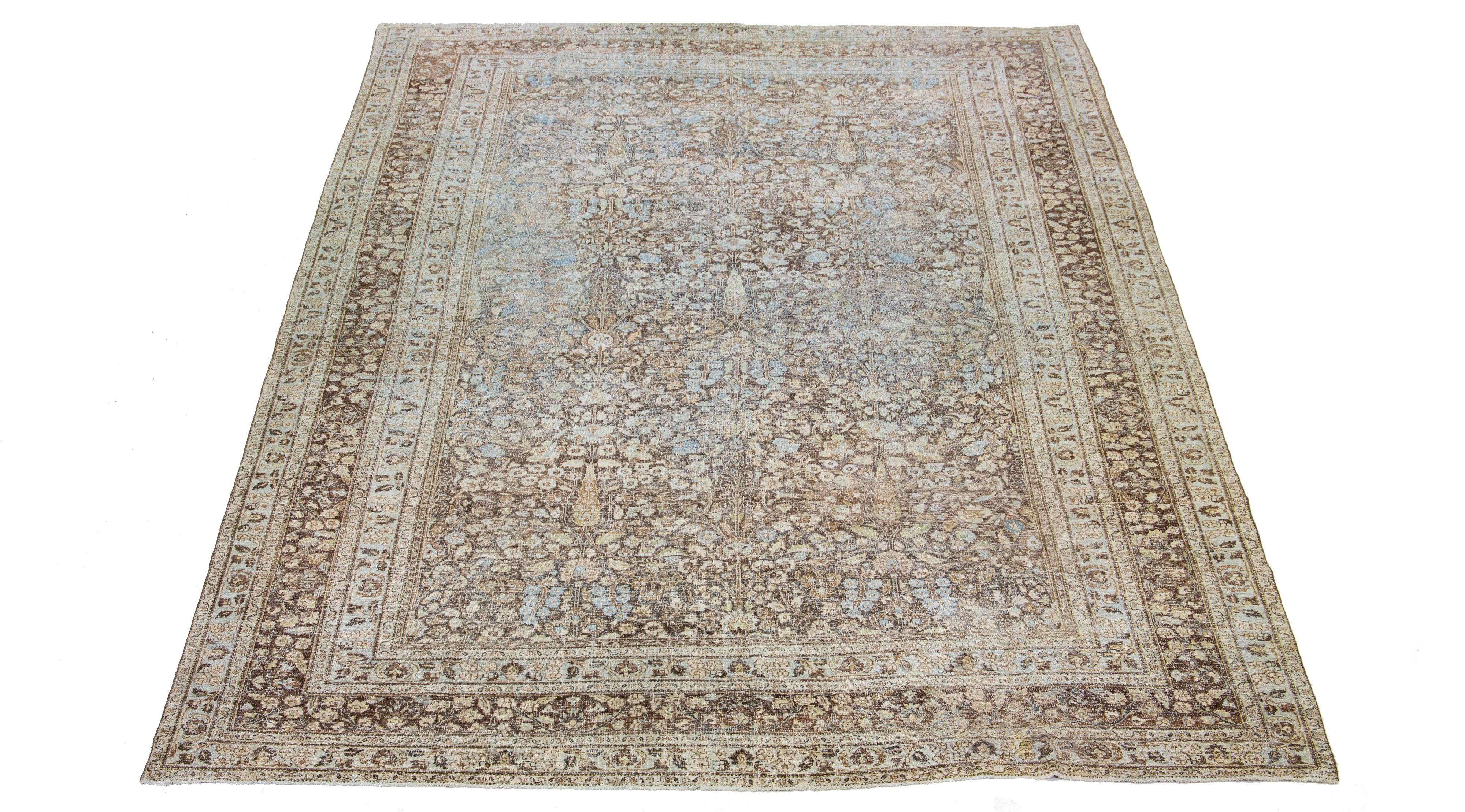 This artisan-crafted Persian Tabriz wool rug dating back to the 1890s, showcases an exquisite, classic rosette pattern. A deep blue hue beautifully punctuates the design, offering a distinct contrast against the rug's brown backdrop.

This rug