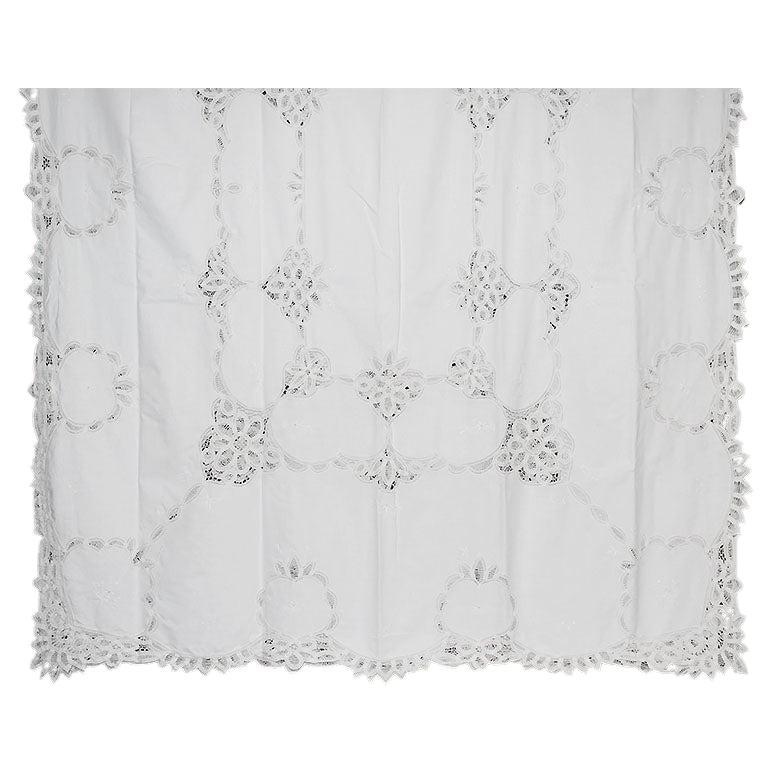 A beautiful handmade battenberg lace tablecloth in crisp white. Created from linen, and cotton, this monumental size table covering will give any dinner party the elegance that it has been yearning for. The edges have a pierced floral crochet motif.