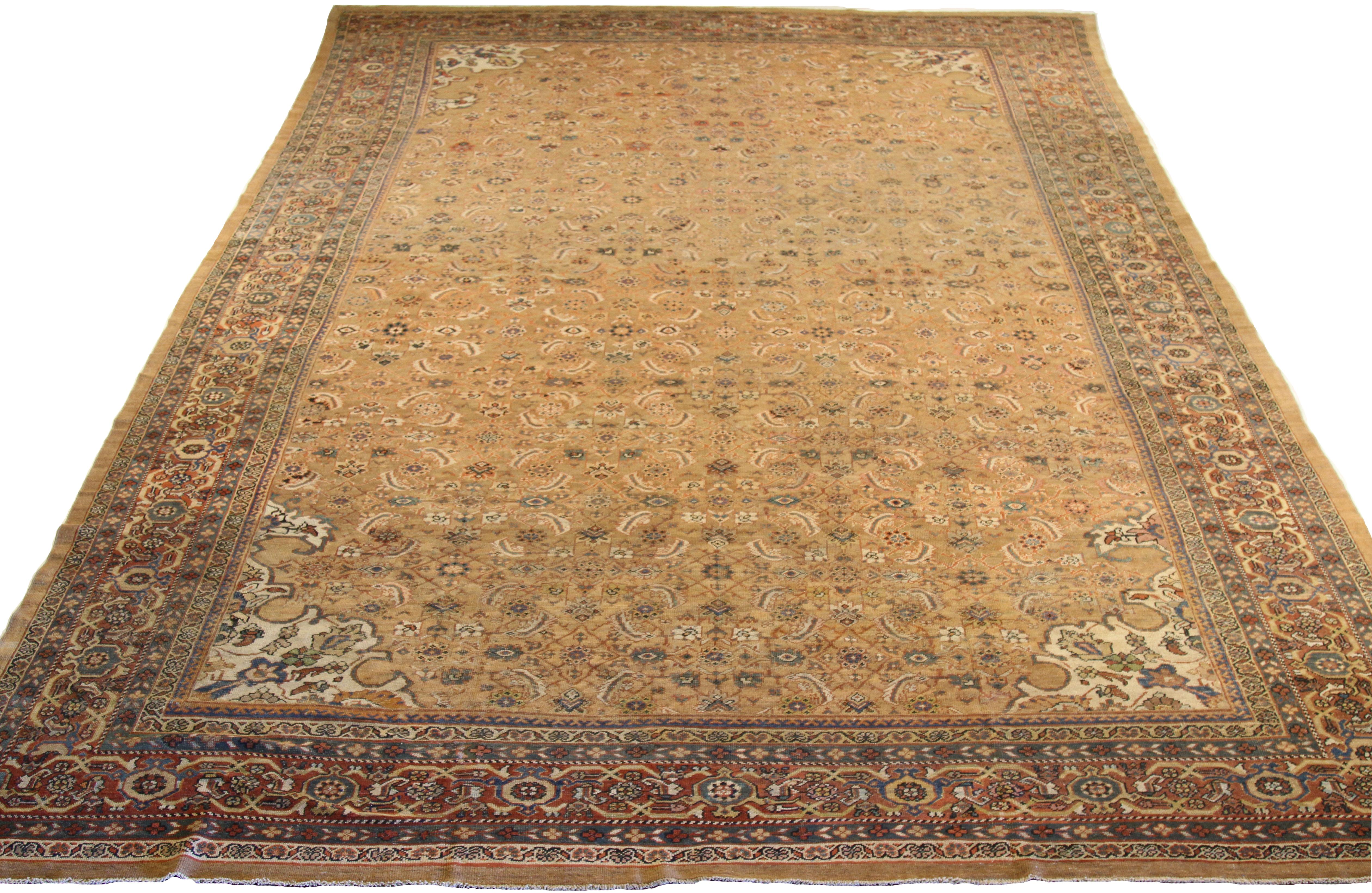 Antique hand-woven Persian area rug made from fine wool and all-natural vegetable dyes that are safe for people and pets. This beautiful piece features a rich field of floral details in various colors which is the traditional weaving design of