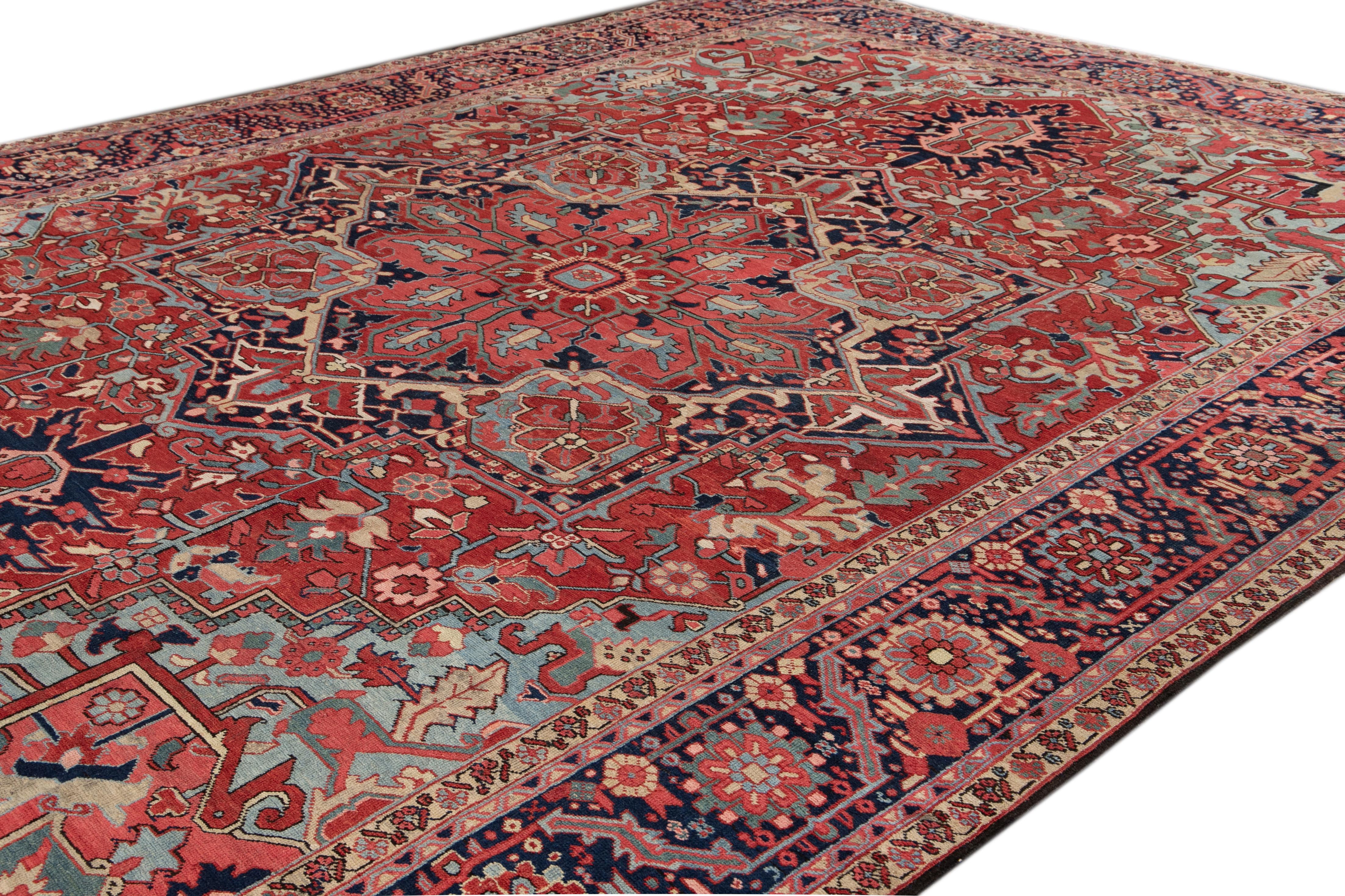 Oversize Antique Heriz Handmade Red & Blue Medallion Motif Wool Rug In Distressed Condition For Sale In Norwalk, CT