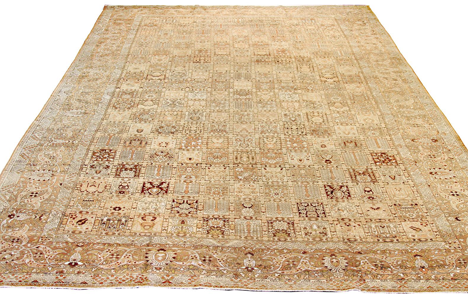 Antique Persian rug handwoven from the finest sheep’s wool and colored with all-natural vegetable dyes that are safe for humans and pets. It’s a traditional Bakhtiar design highlighted by brown and white botanical details over an ivory field. It’s a