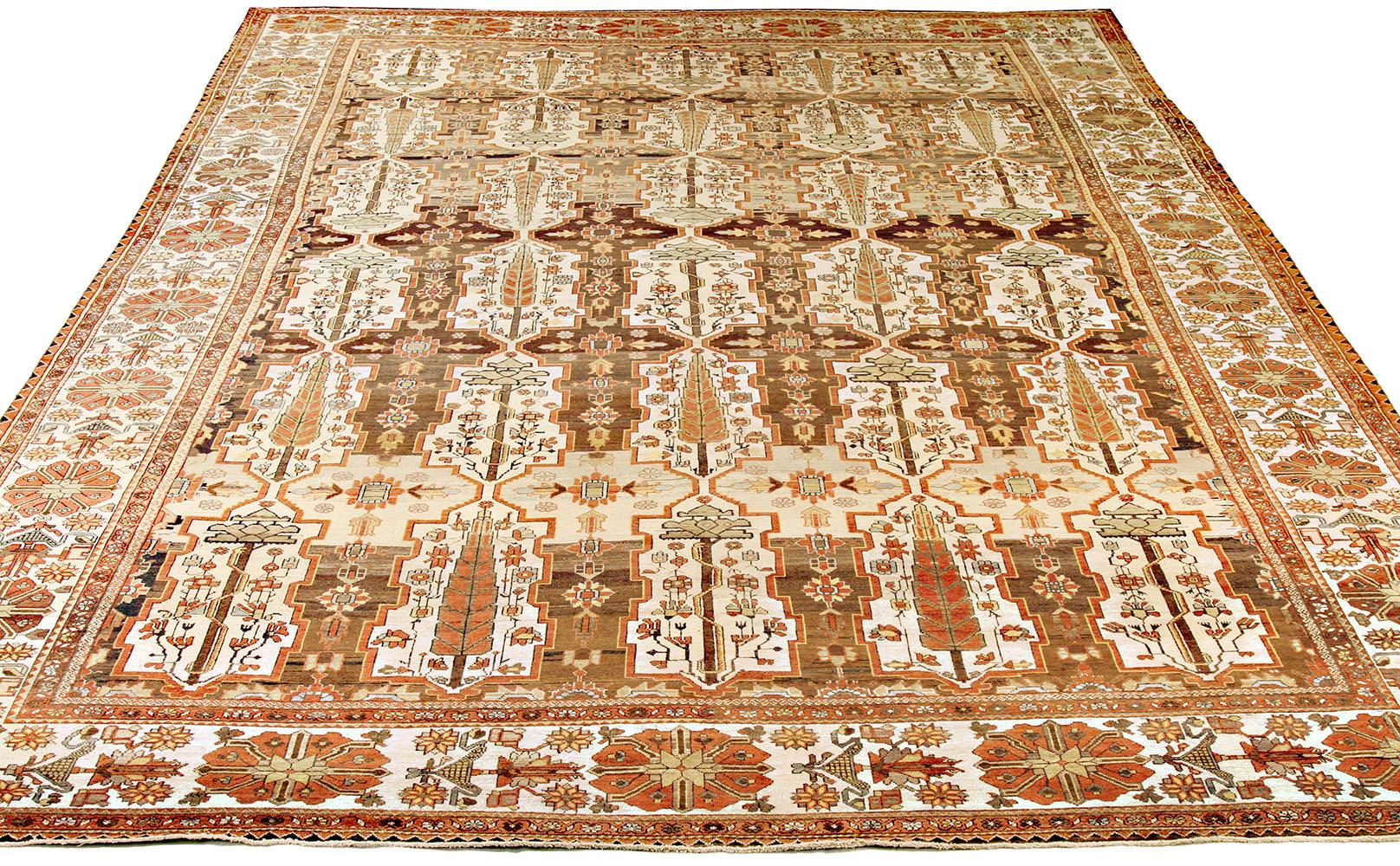 Antique Persian rug handwoven from the finest sheep’s wool and colored with all-natural vegetable dyes that are safe for humans and pets. It’s a traditional Bakhtiar design highlighted by colored tribal details over an ivory and white field. It’s a